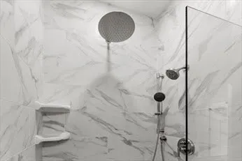 a bathroom with a shower and toilet