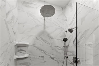 843 Main Street, Unit 104 Clinton, MA 01510 - Photo 12 of 19 a bathroom with a shower and toilet