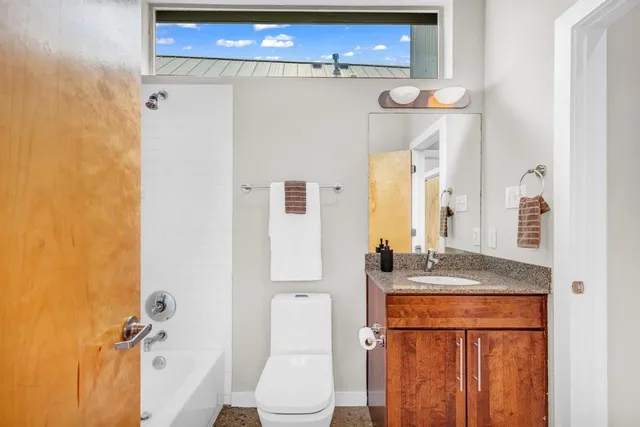 a view of a livingroom with furniture and window