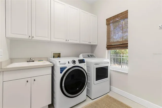 a utility room with dryer and washer