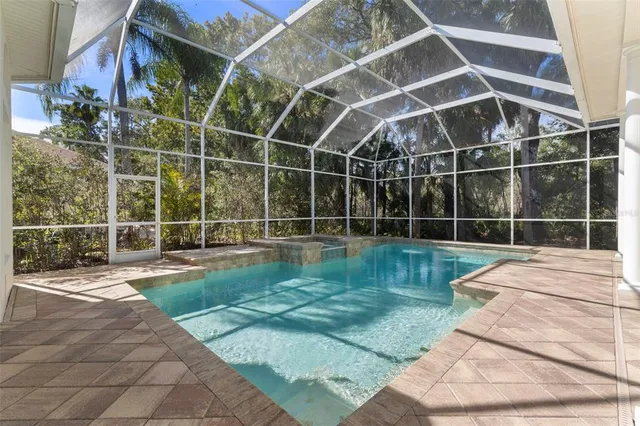 a view of a backyard with a wooden deck
