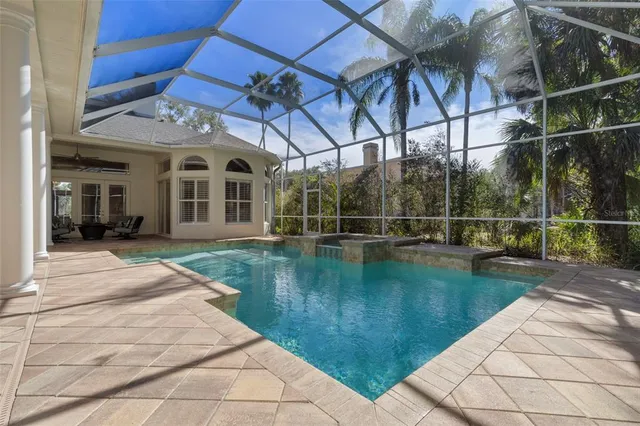 a view of a swimming pool with a patio
