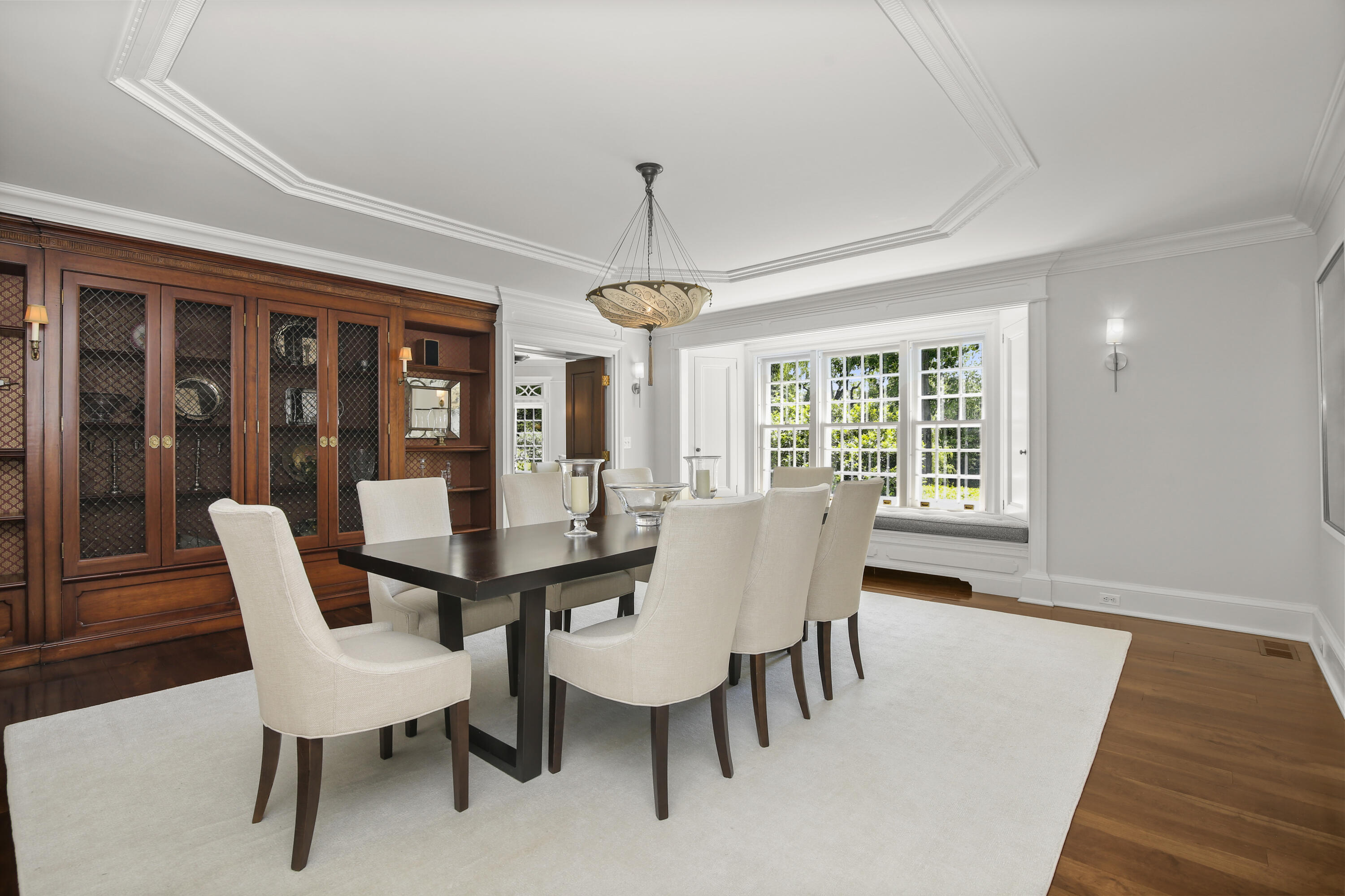 707 West Road New Canaan, CT 06840 - Photo 14 of 58 a view of a dining room with furniture wooden floor and chandelier