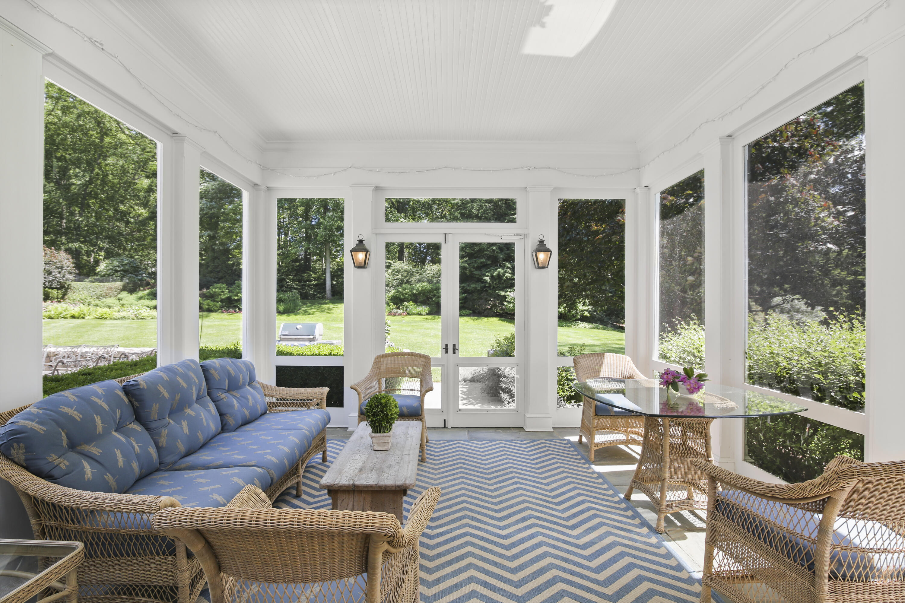707 West Road New Canaan, CT 06840 - Photo 18 of 58 a living room with furniture and a floor to ceiling window
