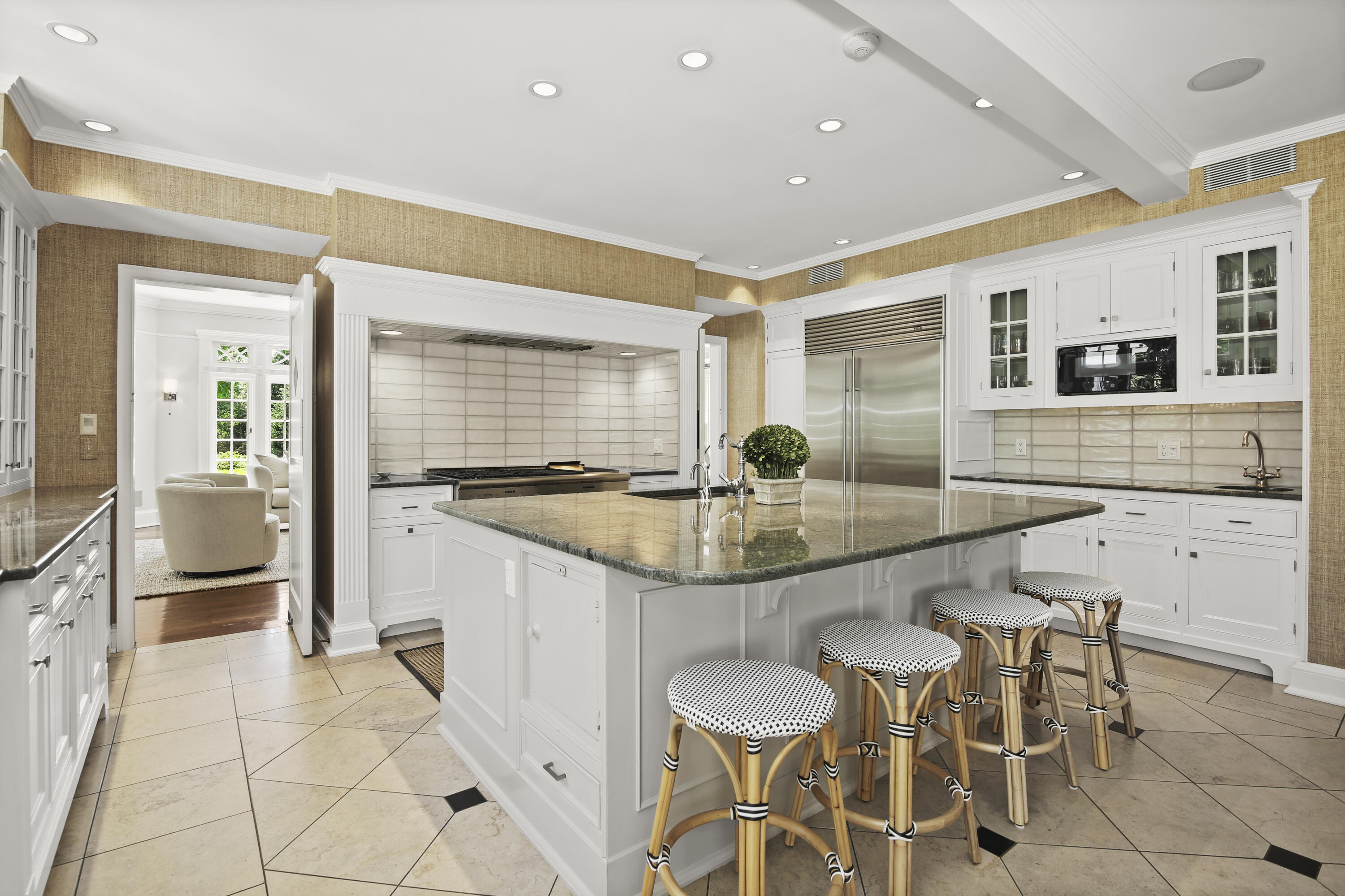 707 West Road New Canaan, CT 06840 - Photo 19 of 58 a kitchen with granite countertop a table and chairs in it