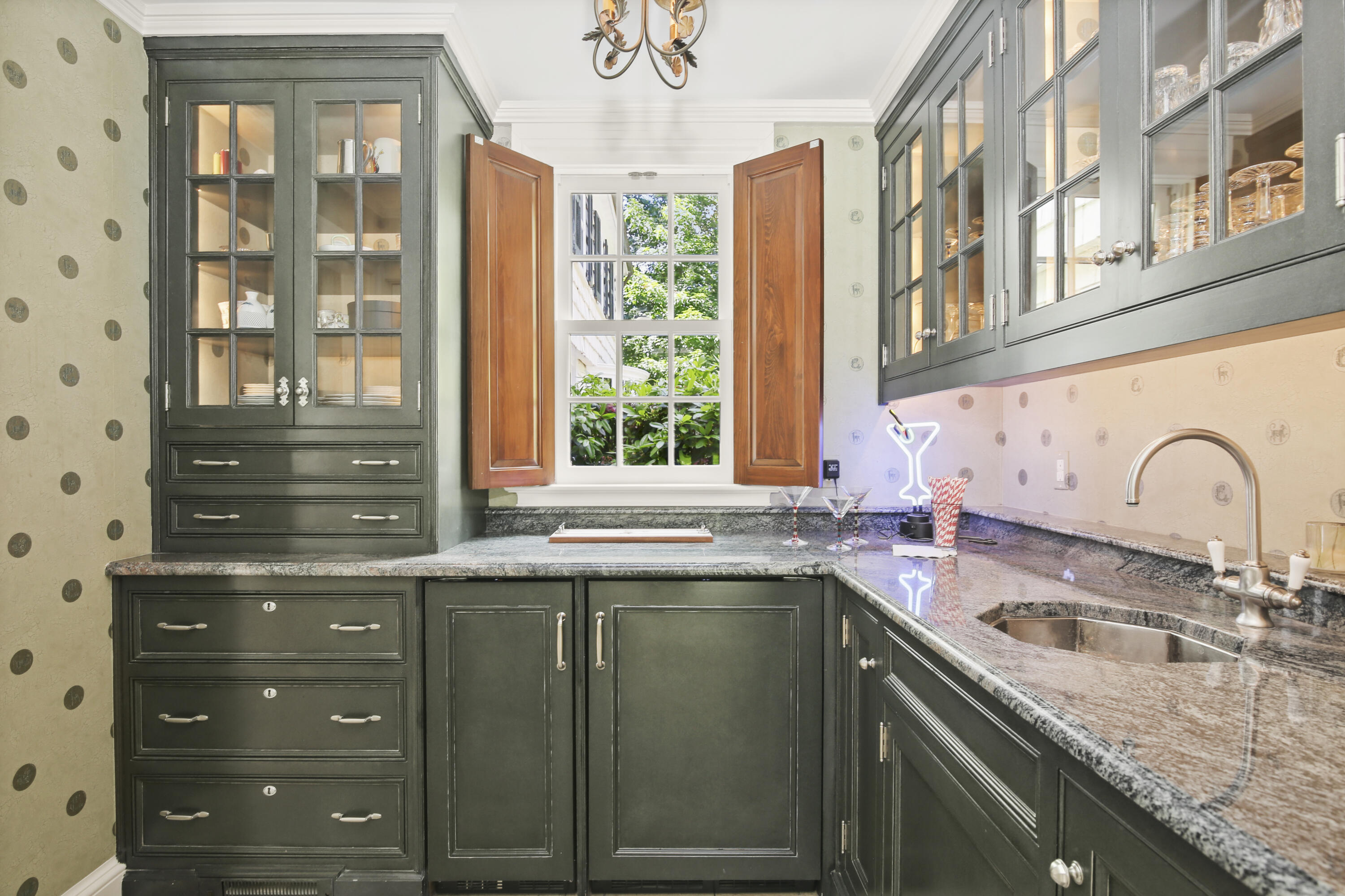 707 West Road New Canaan, CT 06840 - Photo 24 of 58 a kitchen with stainless steel appliances granite countertop a sink and a window