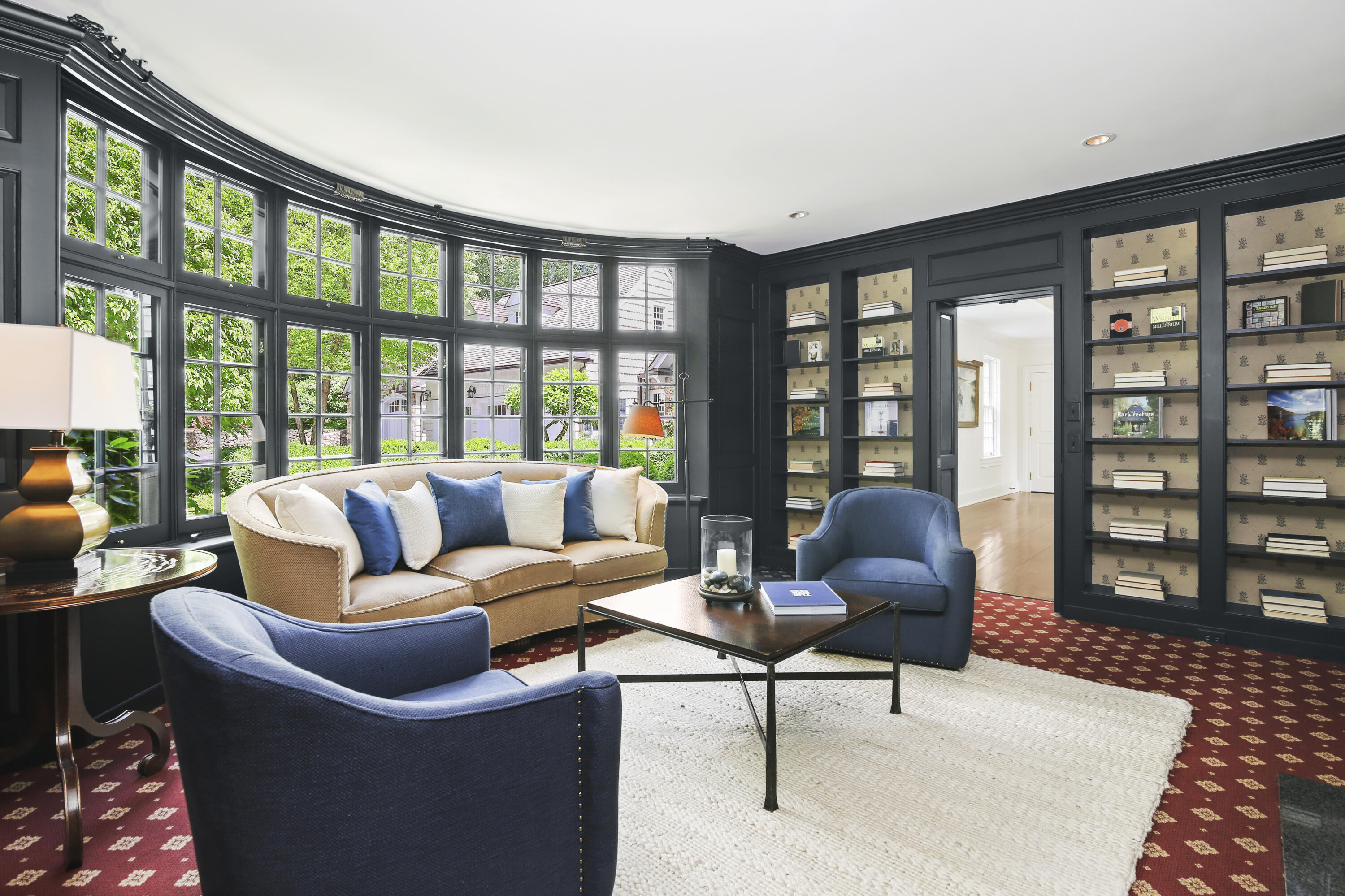 707 West Road New Canaan, CT 06840 - Photo 25 of 58 a living room with furniture and a floor to ceiling window