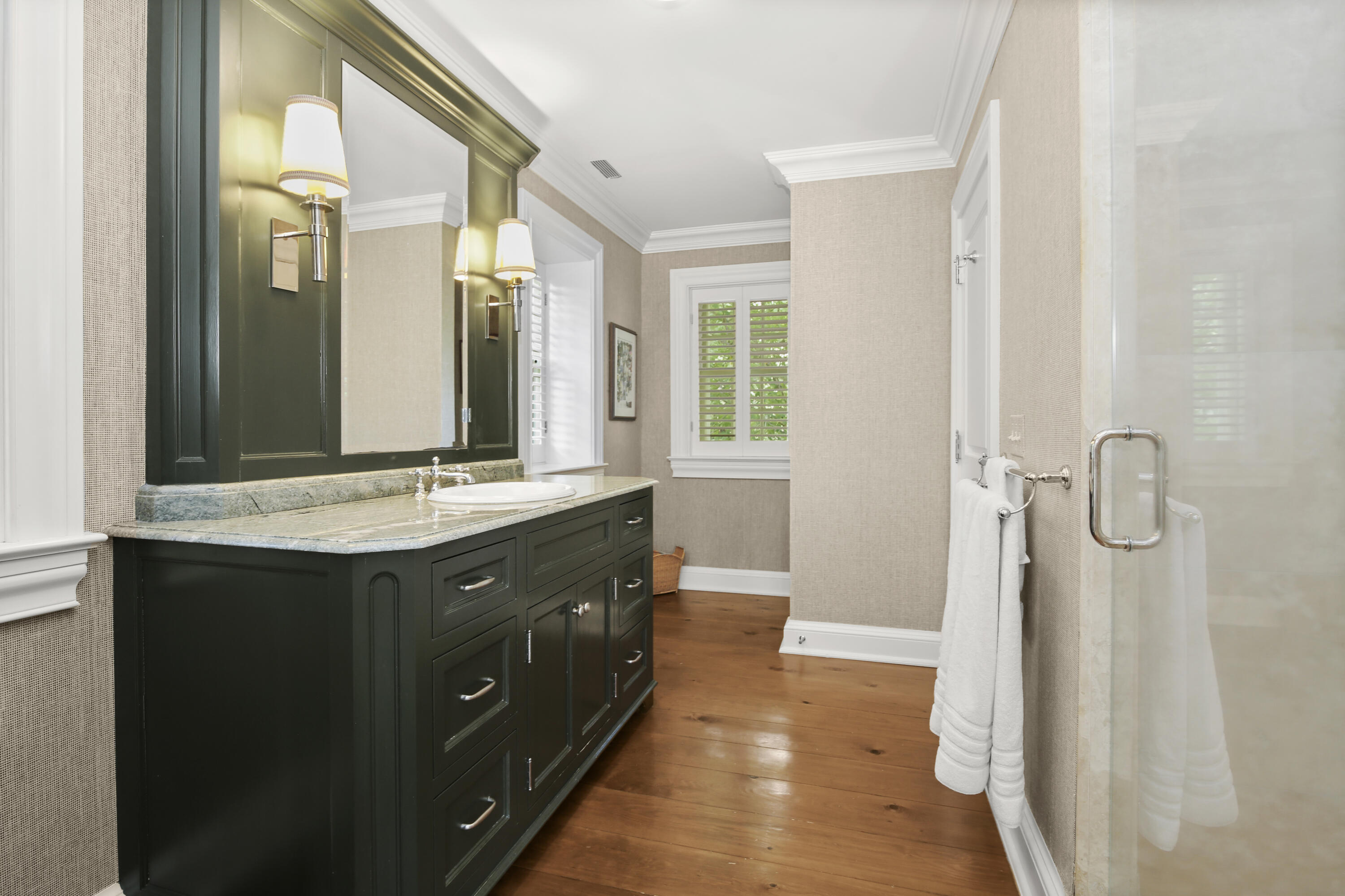 707 West Road New Canaan, CT 06840 - Photo 34 of 58 a bathroom with a double vanity sink and mirror