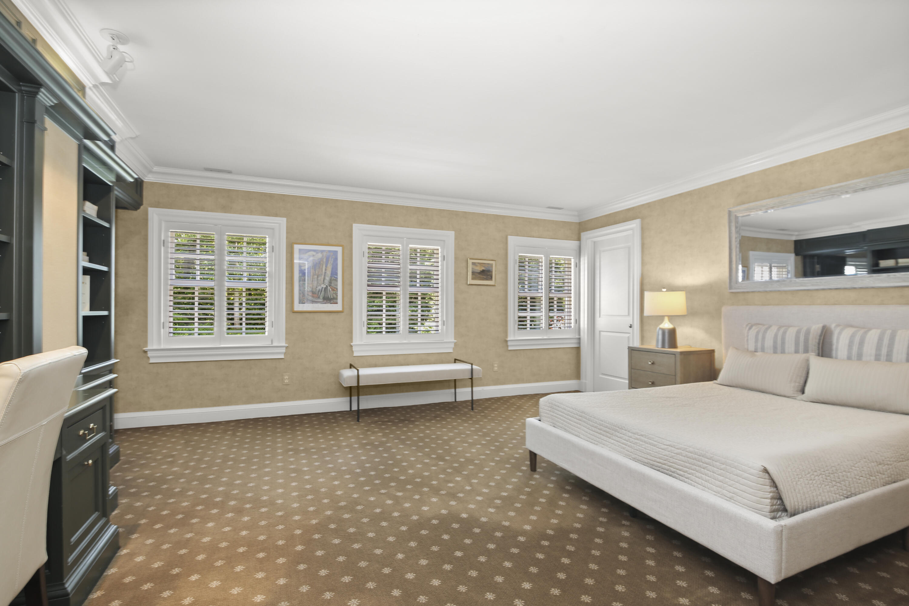 707 West Road New Canaan, CT 06840 - Photo 37 of 58 a spacious bedroom with a large bed and a couch