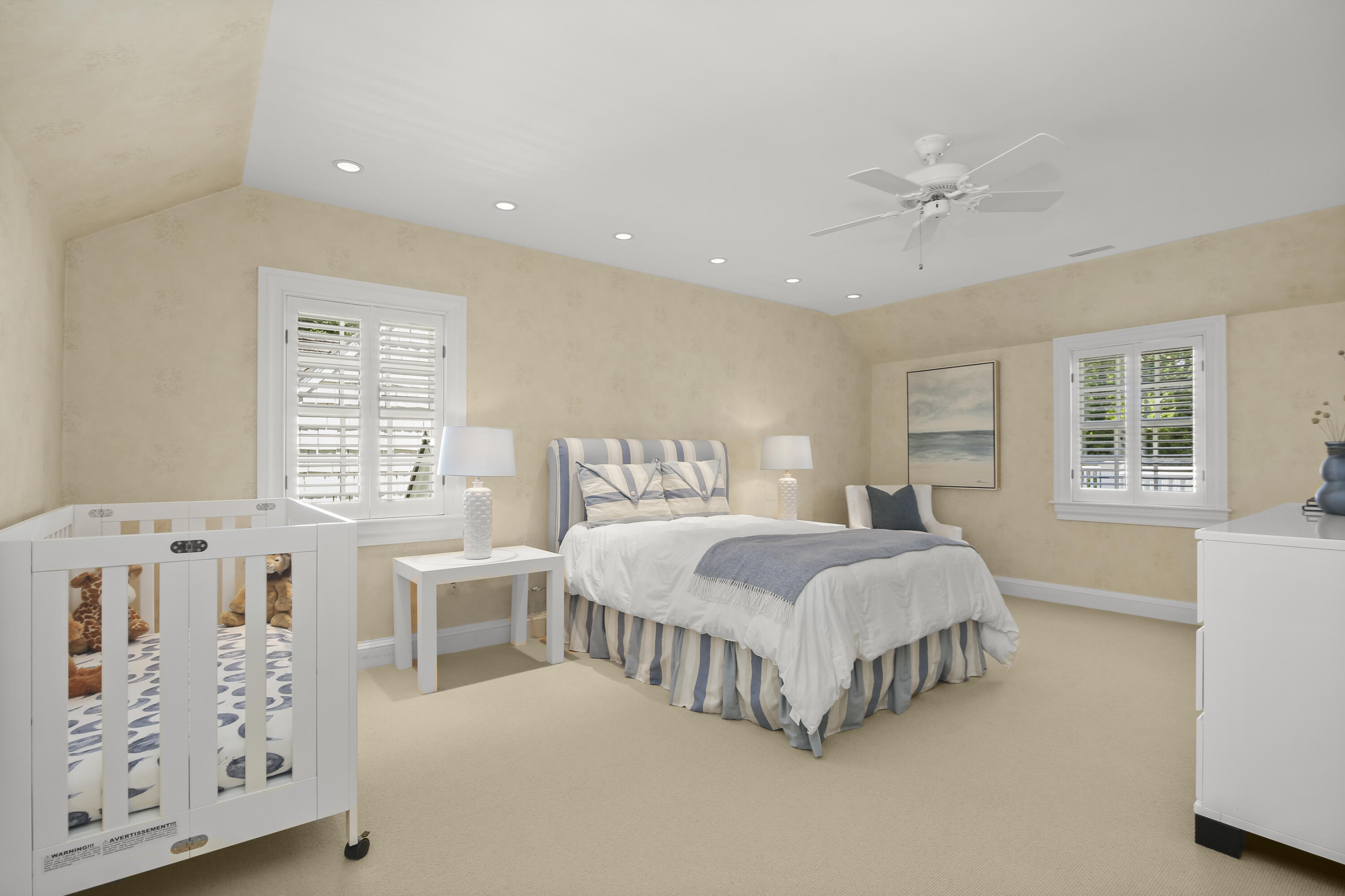 707 West Road New Canaan, CT 06840 - Photo 40 of 58 a spacious bedroom with a large bed and a window