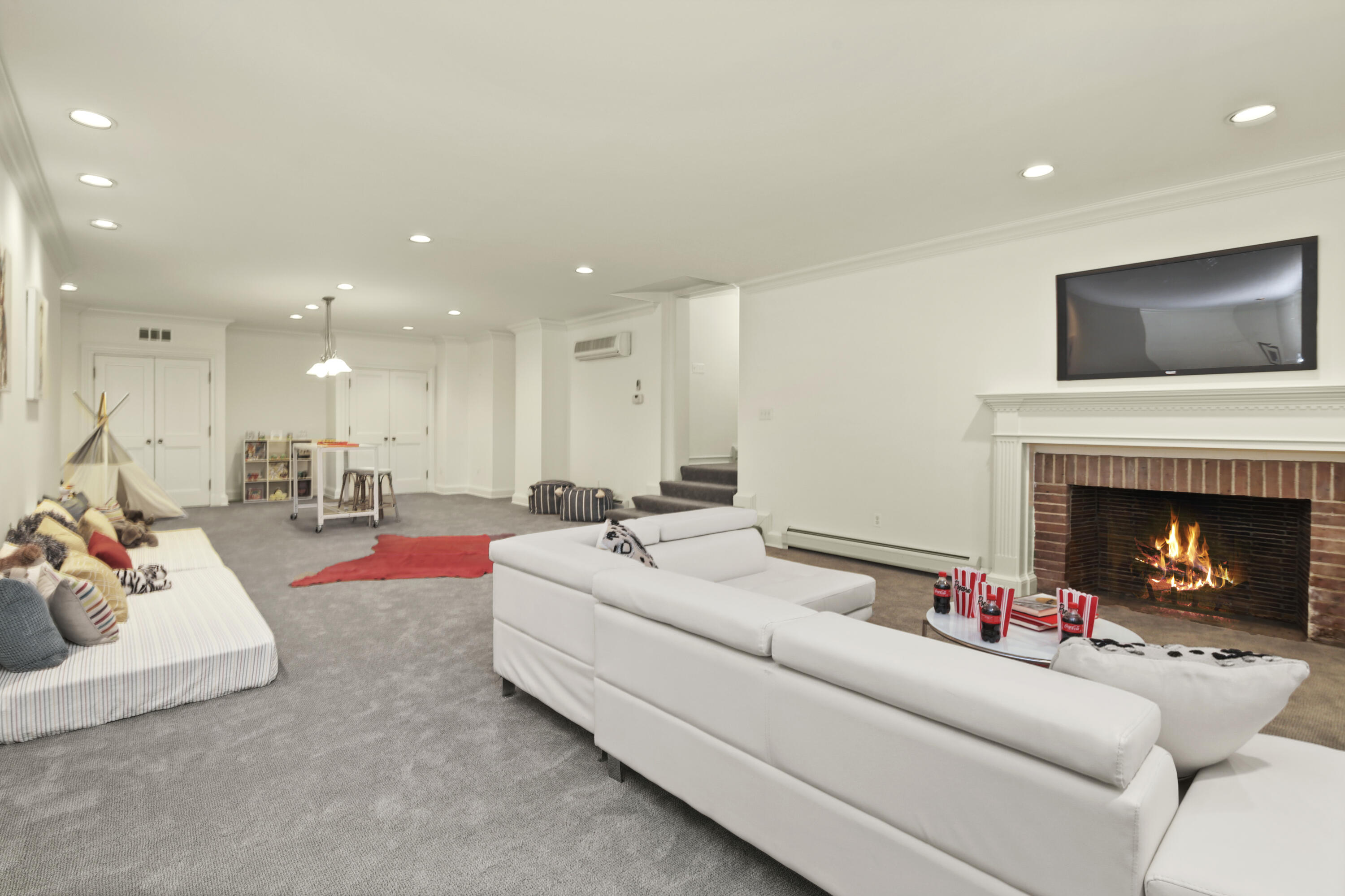 707 West Road New Canaan, CT 06840 - Photo 50 of 58 a living room with furniture and a fireplace