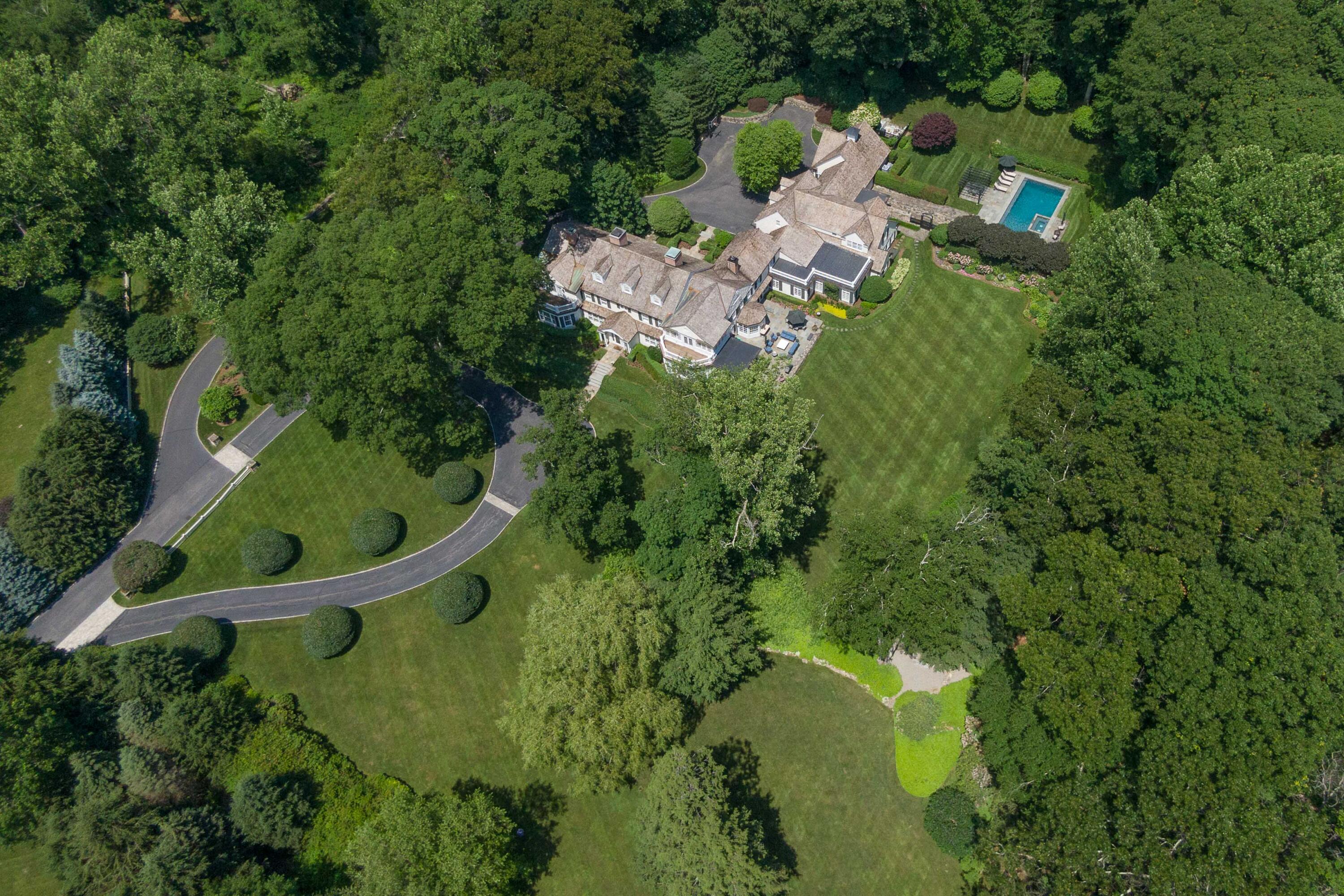 707 West Road New Canaan, CT 06840 - Photo 57 of 58 an aerial view of a house with a yard basket ball court and outdoor seating