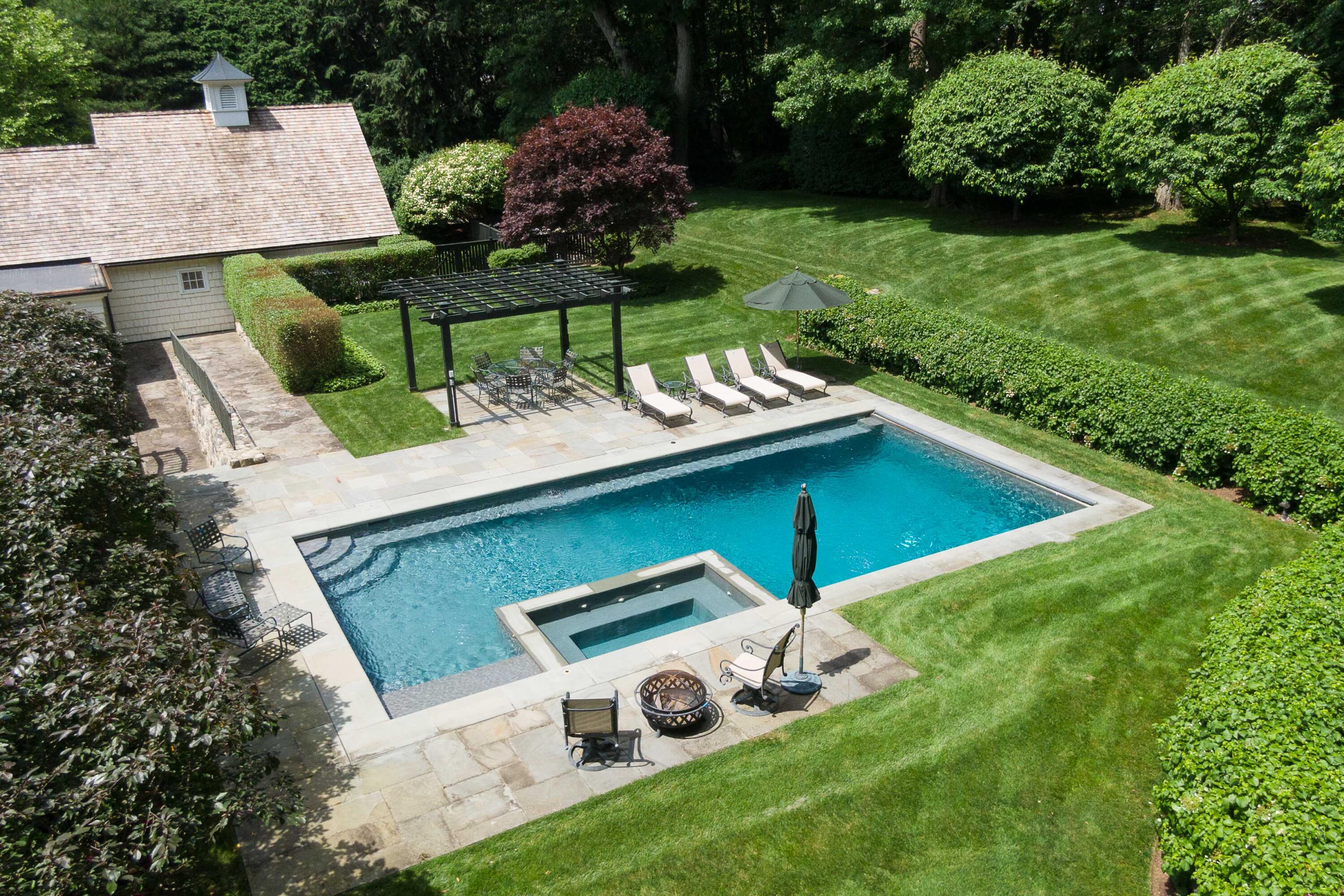 707 West Road New Canaan, CT 06840 - Photo 6 of 58 a view of backyard with a garden and plants