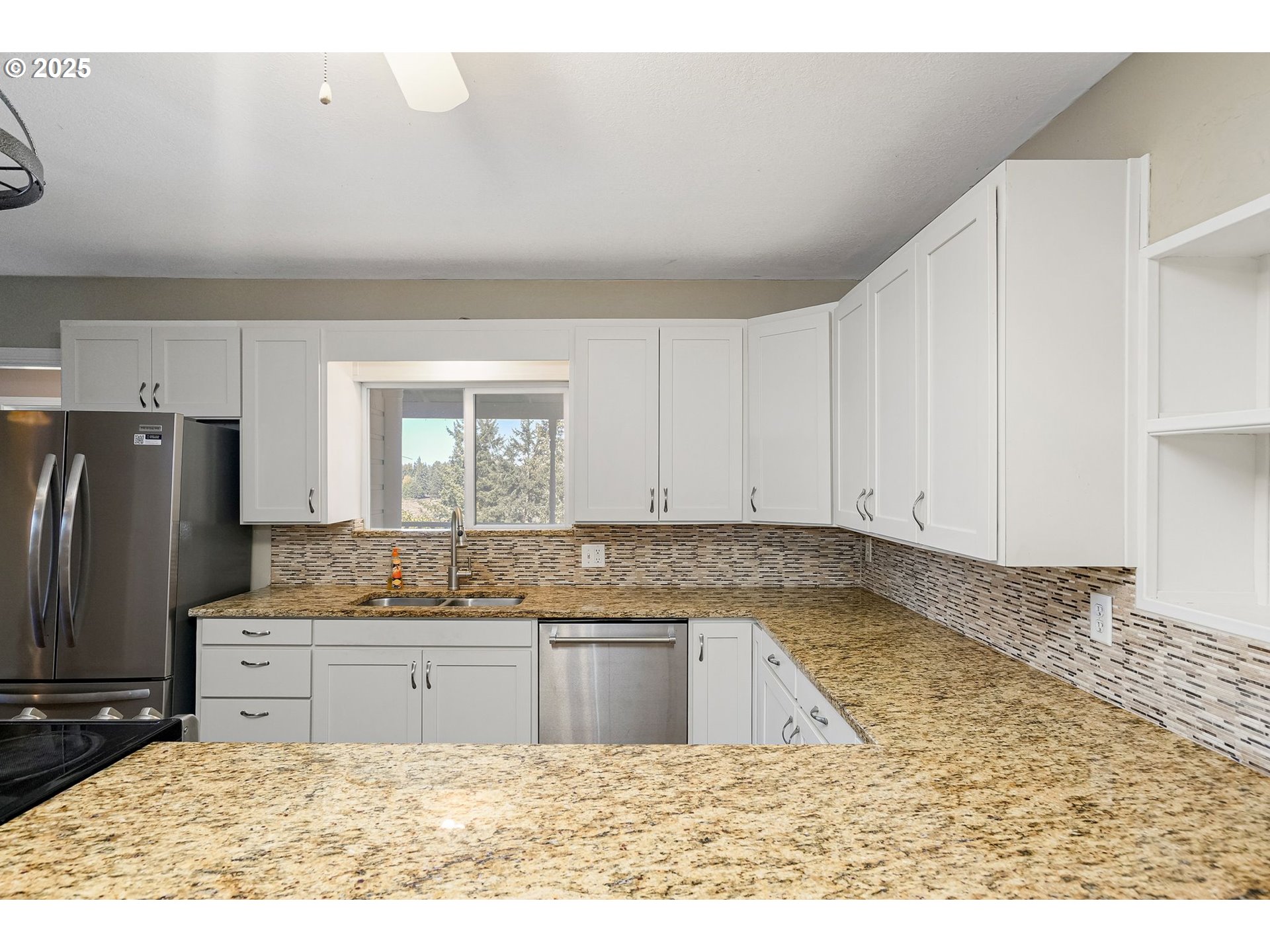 41036 Stayton Scio Road Southeast Stayton, OR 97383 - Photo 12 of 47 a kitchen with a sink refrigerator and cabinets
