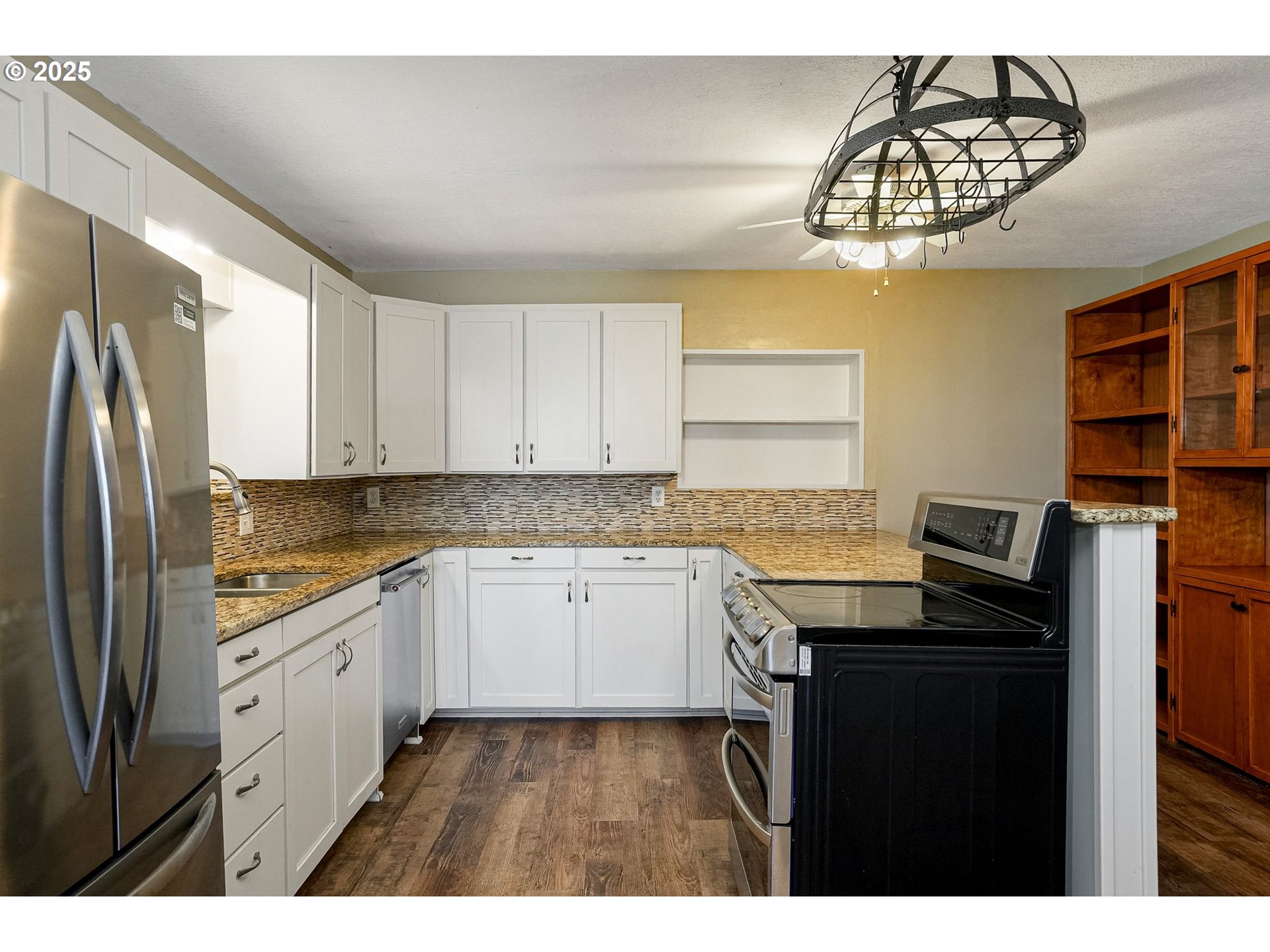 41036 Stayton Scio Road Southeast Stayton, OR 97383 - Photo 13 of 47 a kitchen with granite countertop a sink cabinets stainless steel appliances and a window