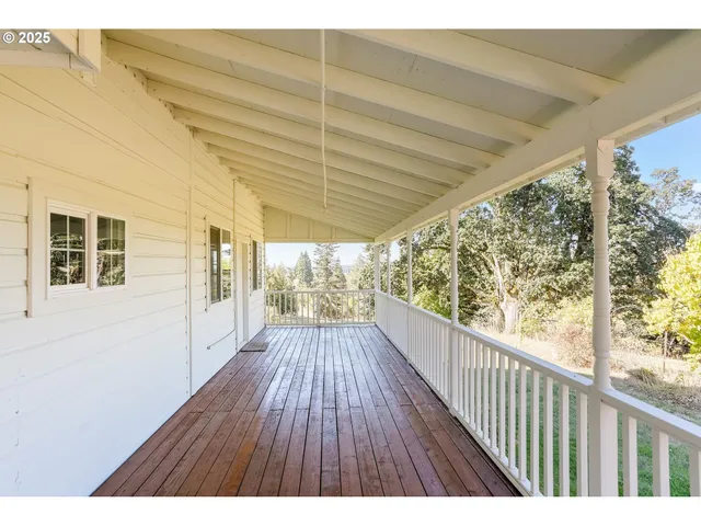 a view of balcony with wooden floor