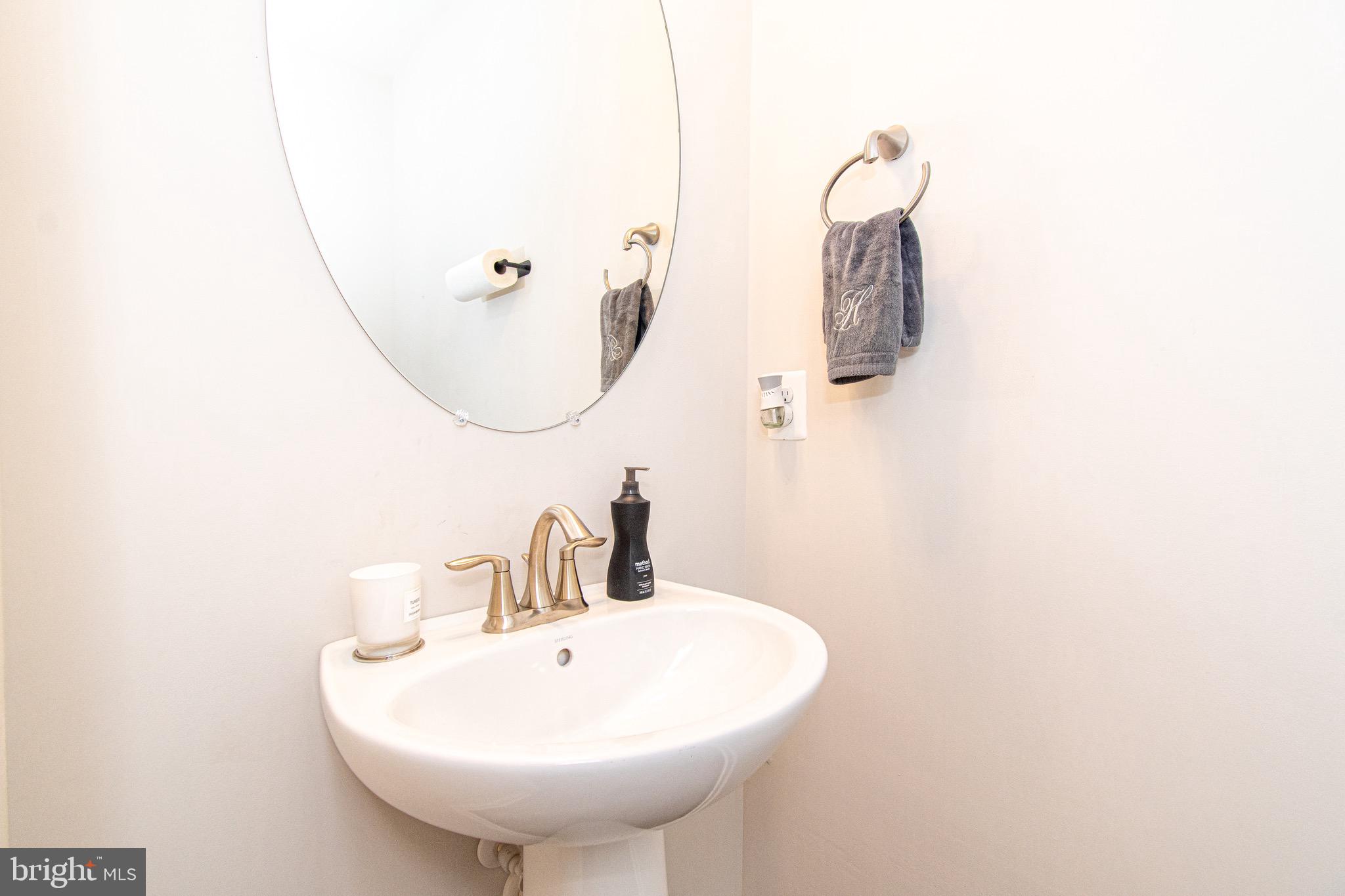 9637 Block Street Lanham, MD 20706 - Photo 11 of 47 a bathroom with a sink and mirror