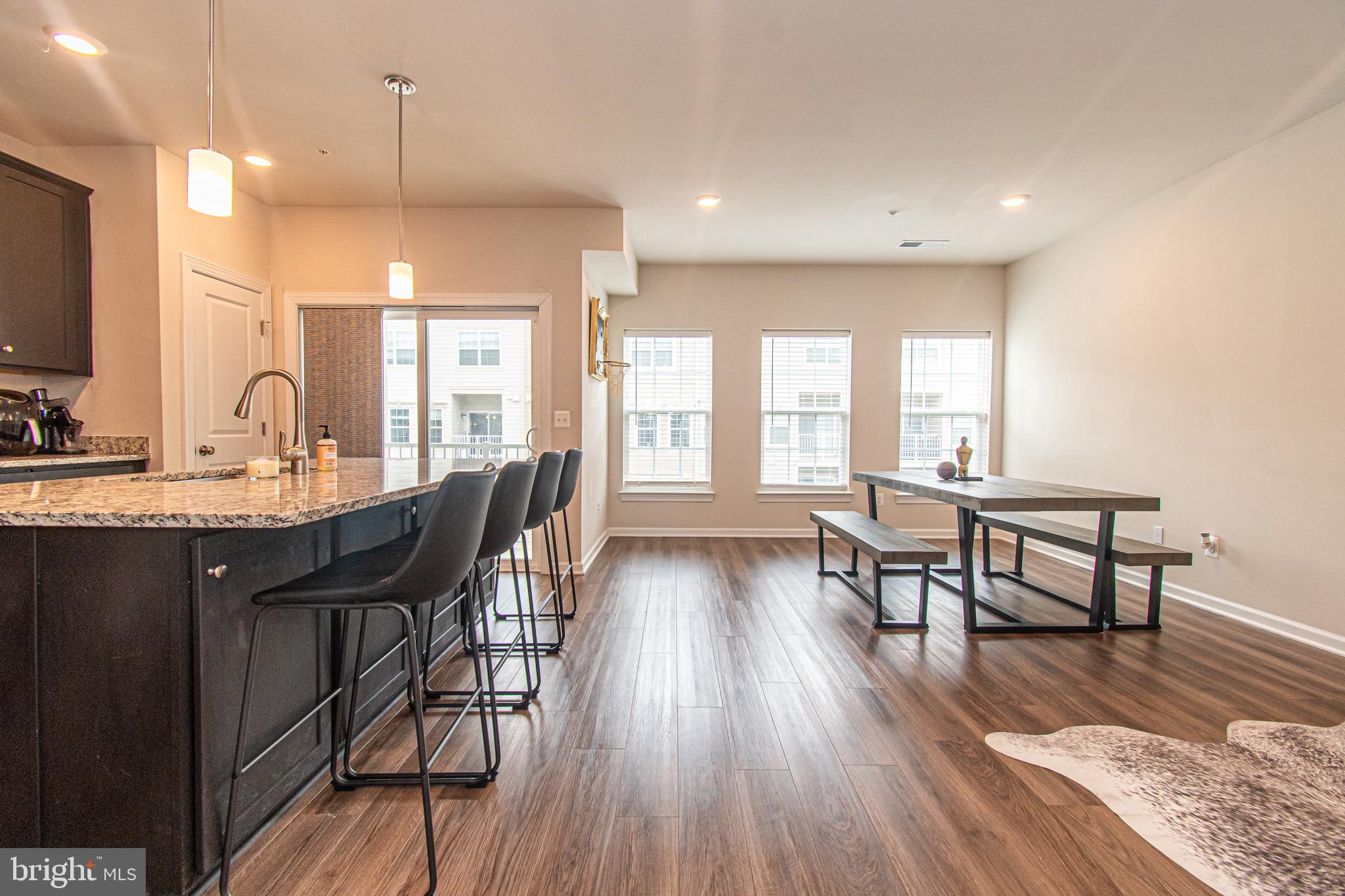 9637 Block Street Lanham, MD 20706 - Photo 13 of 47 a view of a a dining room with furniture window and wooden floor