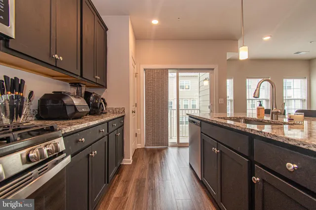 a spacious bedroom with a bed and painting on the wall