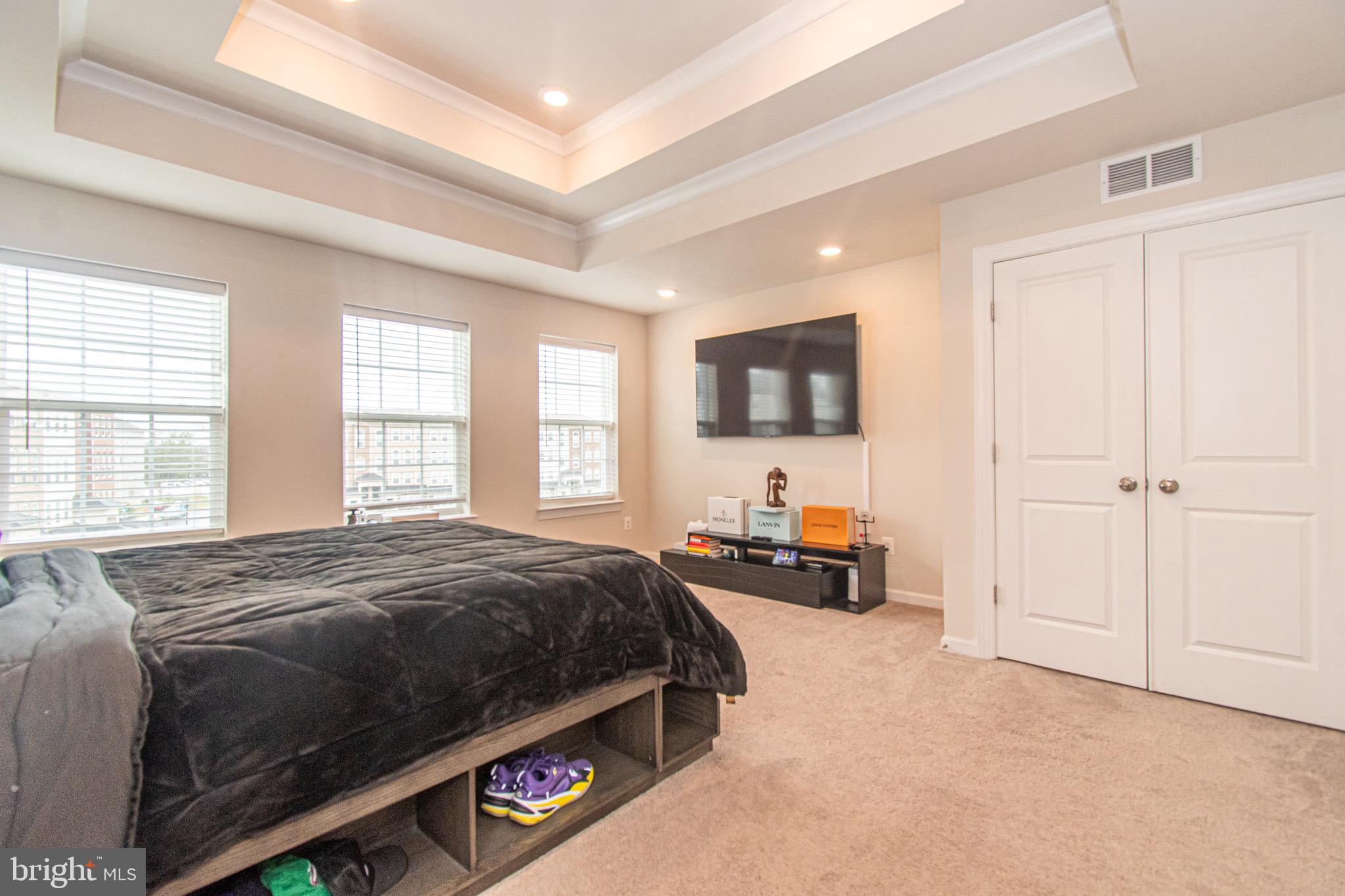 9637 Block Street Lanham, MD 20706 - Photo 24 of 47 a bed room with a bed and a tv