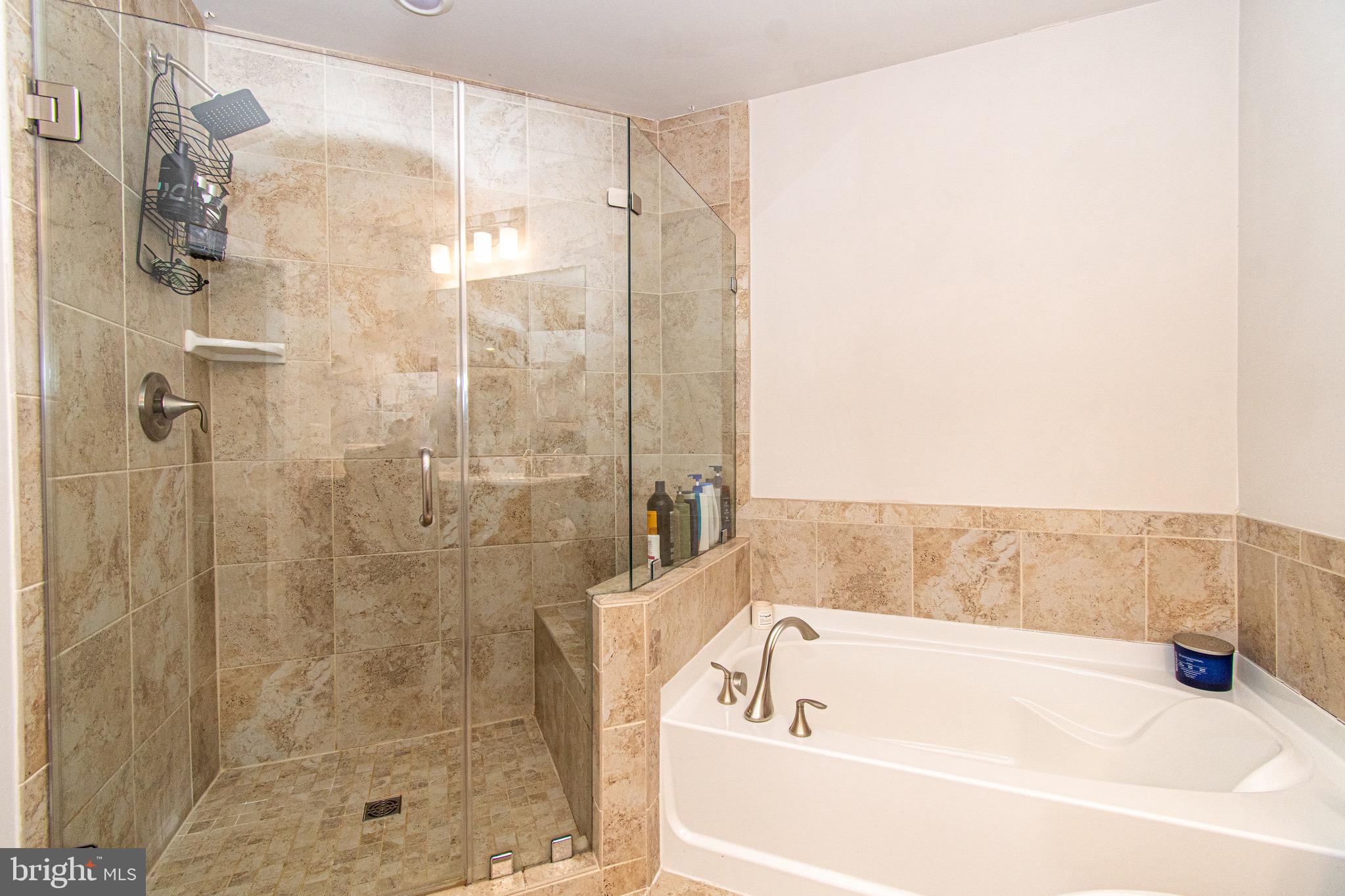 9637 Block Street Lanham, MD 20706 - Photo 27 of 47 a bathroom with a bathtub and shower