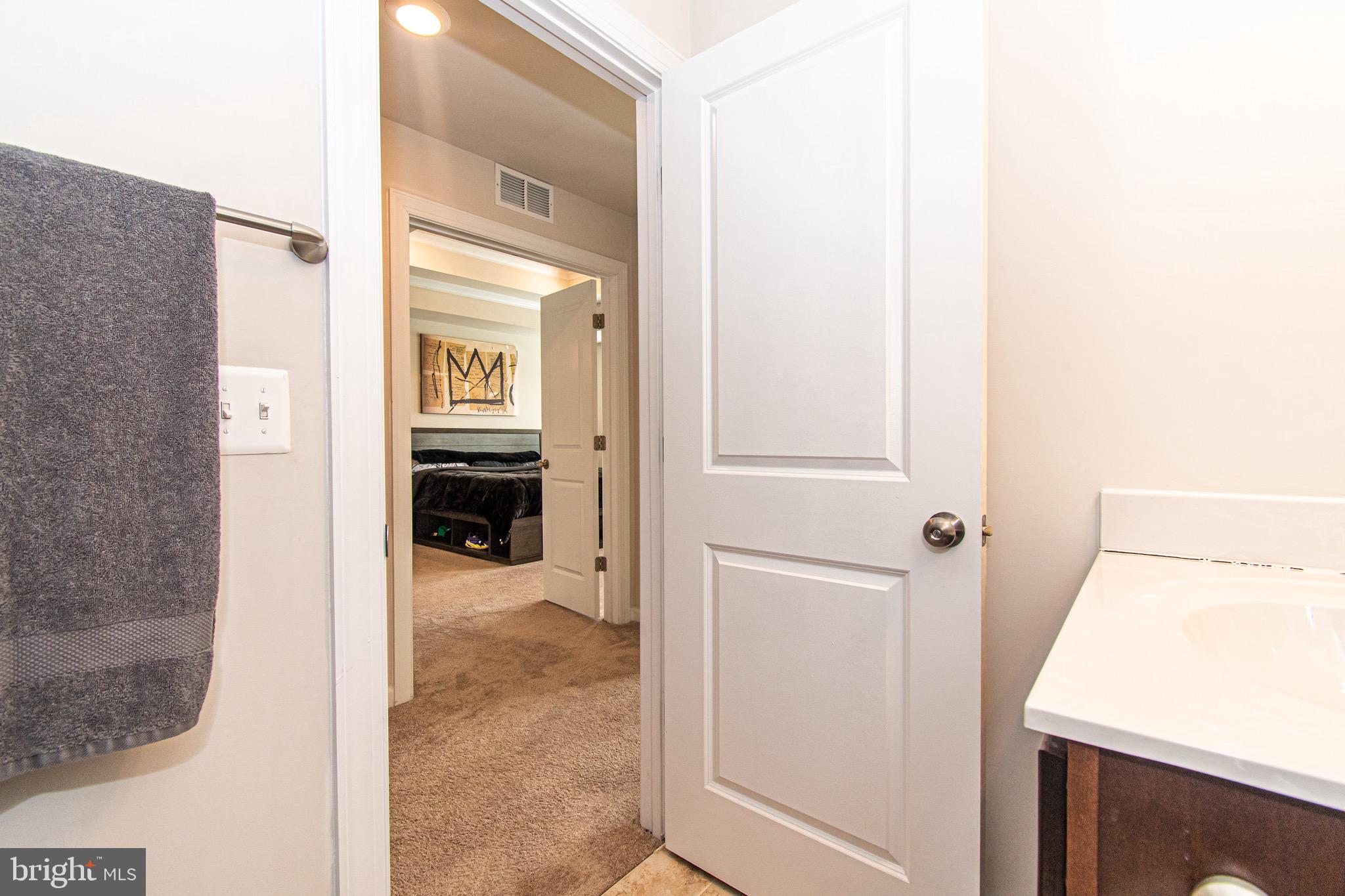 9637 Block Street Lanham, MD 20706 - Photo 29 of 47 a view of a hallway and wooden floor