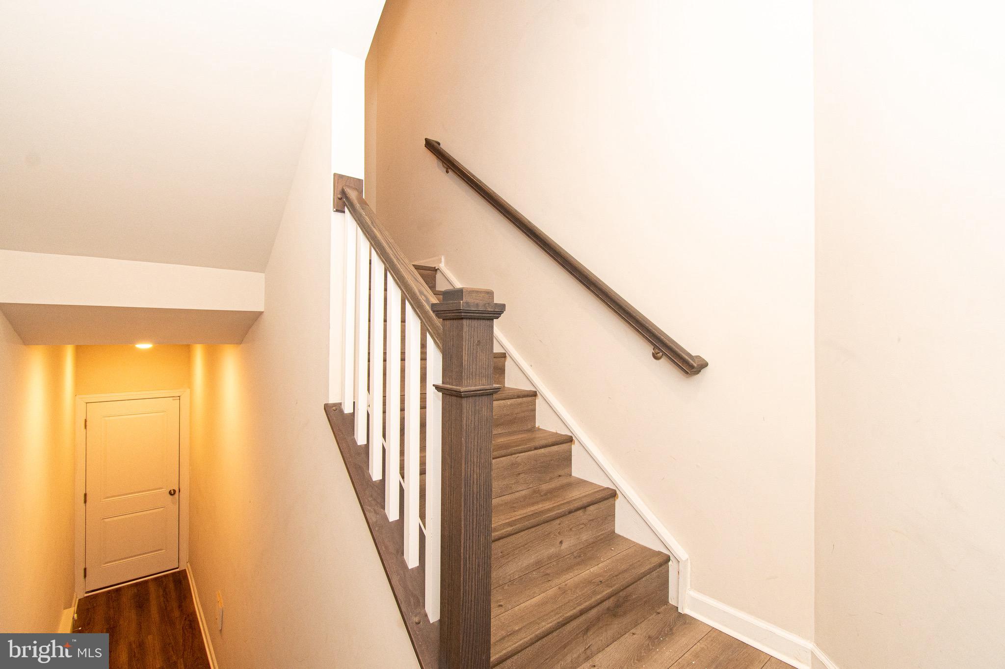 9637 Block Street Lanham, MD 20706 - Photo 3 of 47 a view of a hallway with staircase
