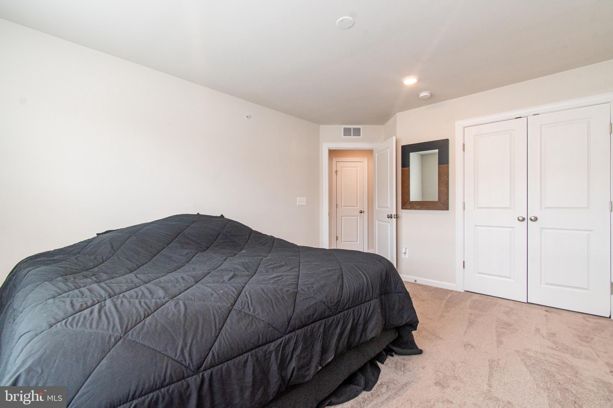 9637 Block Street Lanham, MD 20706 - Photo 33 of 47 a bedroom with a bed and a closet