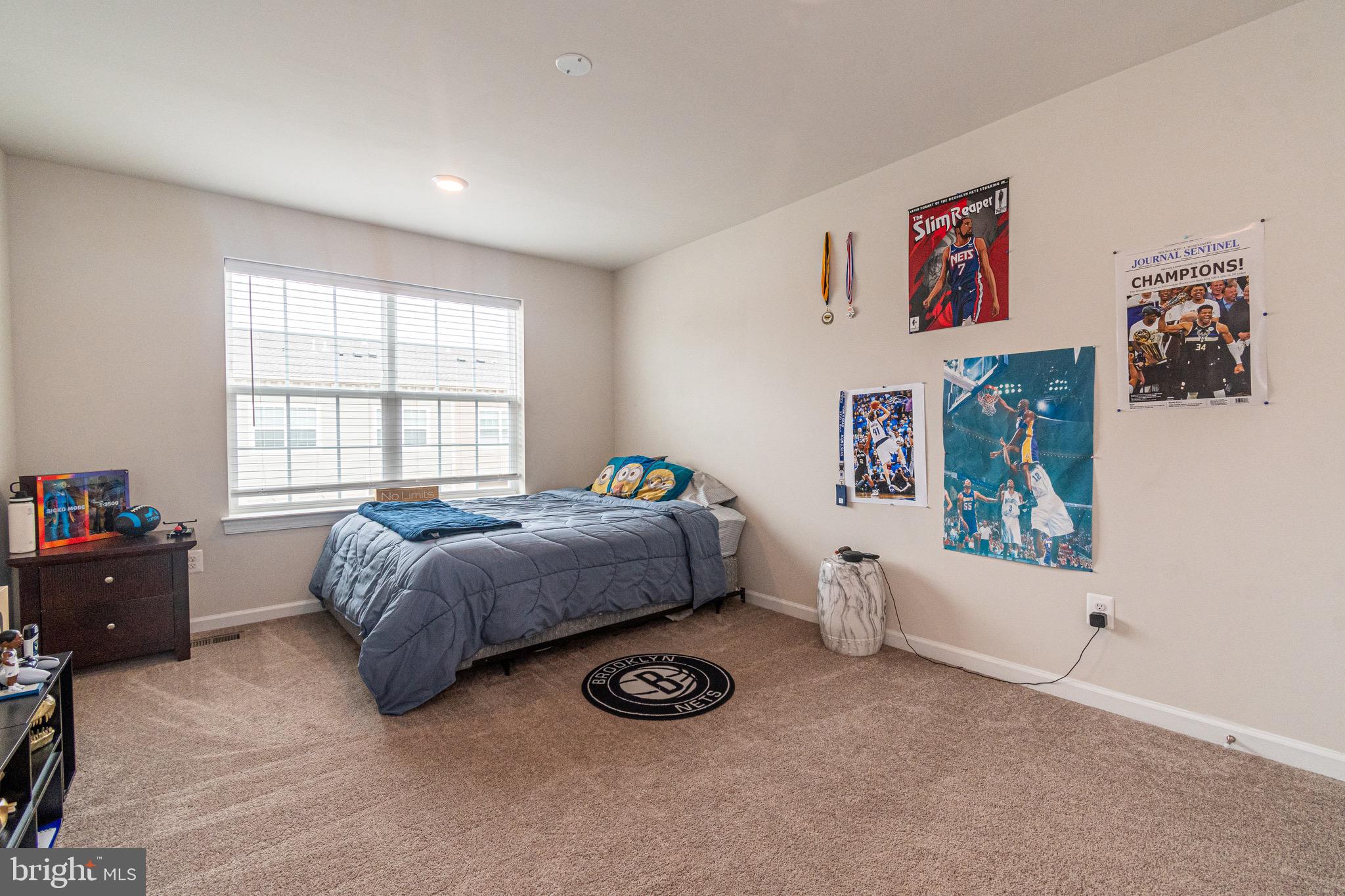 9637 Block Street Lanham, MD 20706 - Photo 34 of 47 a bedroom with a bed and a window