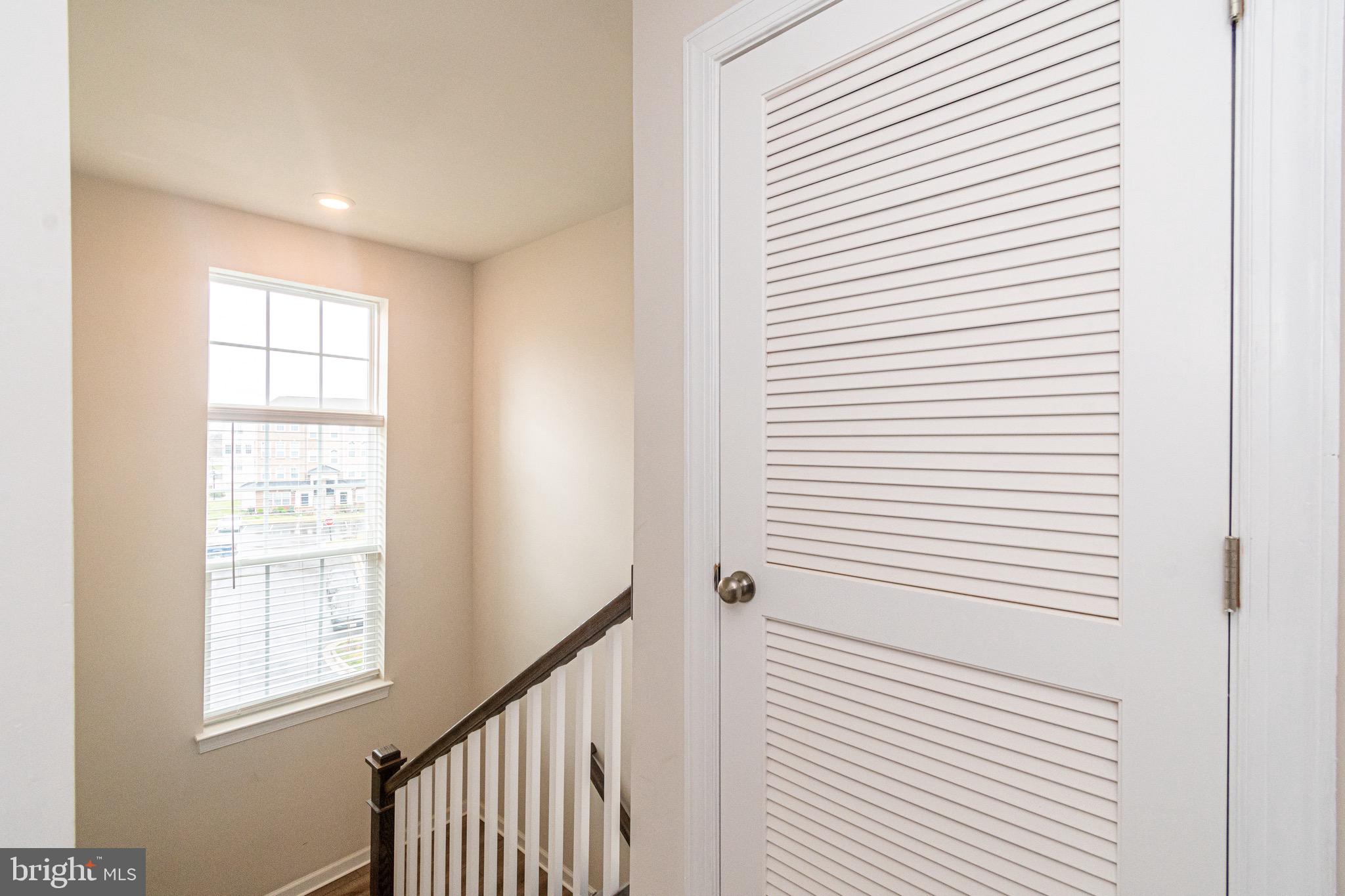 9637 Block Street Lanham, MD 20706 - Photo 39 of 47 a view of a hallway with windows