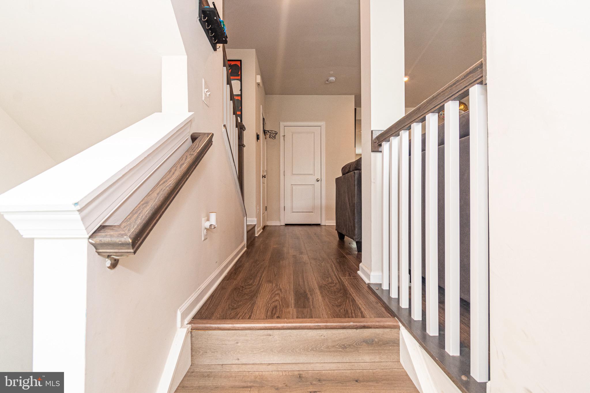 9637 Block Street Lanham, MD 20706 - Photo 41 of 47 a view of staircase with lots of frames on wall and a large window