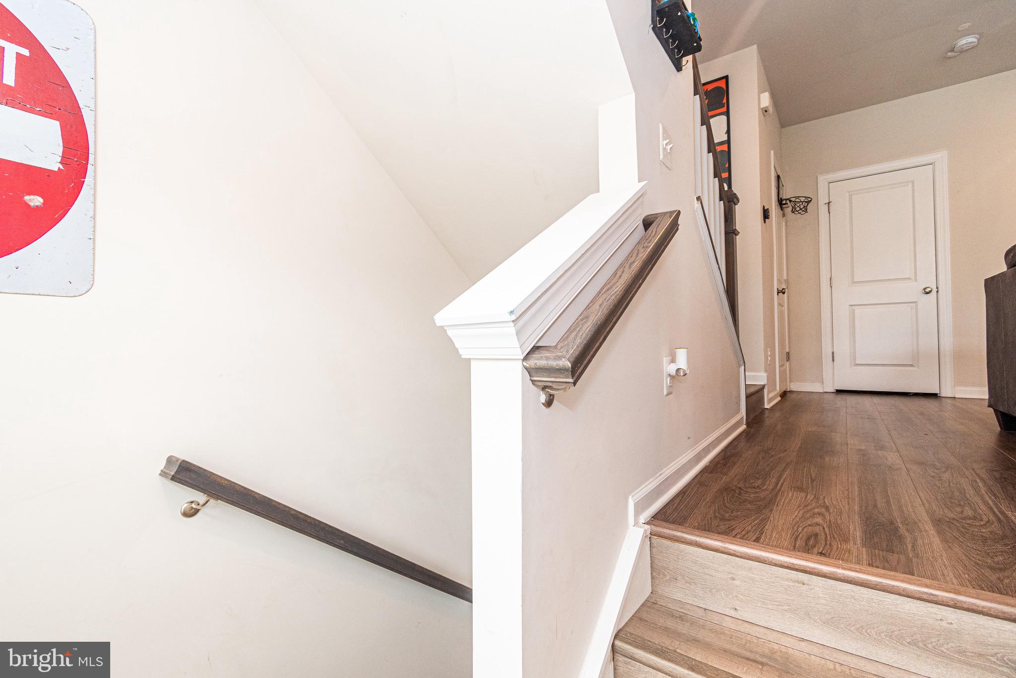 9637 Block Street Lanham, MD 20706 - Photo 42 of 47 a view of a livingroom with wooden floor and stairs