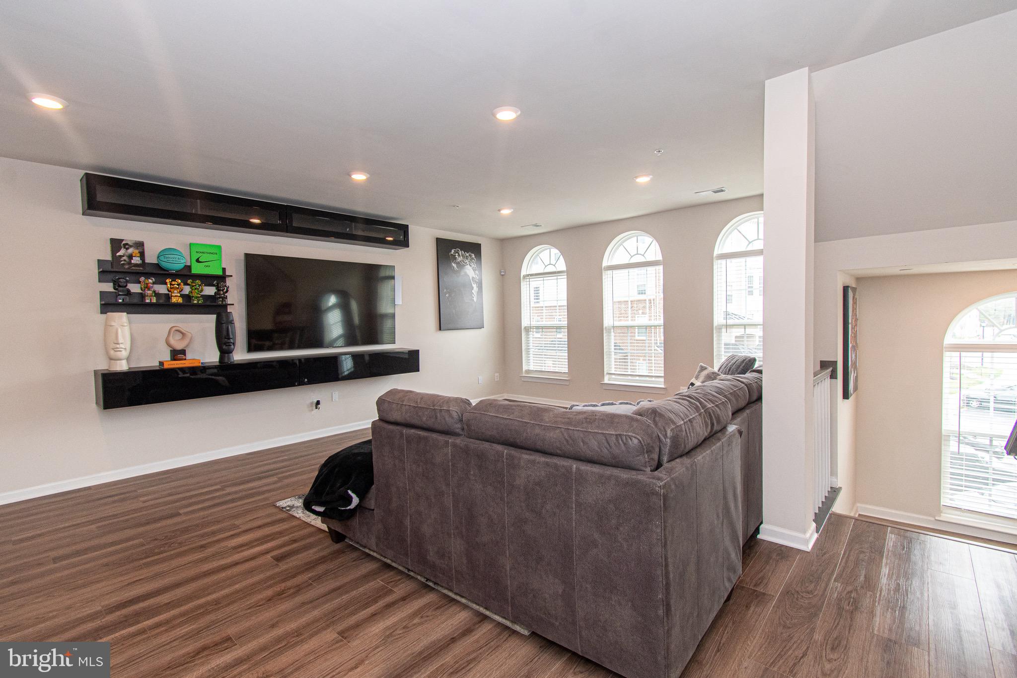 9637 Block Street Lanham, MD 20706 - Photo 7 of 47 a living room with furniture and a flat screen tv