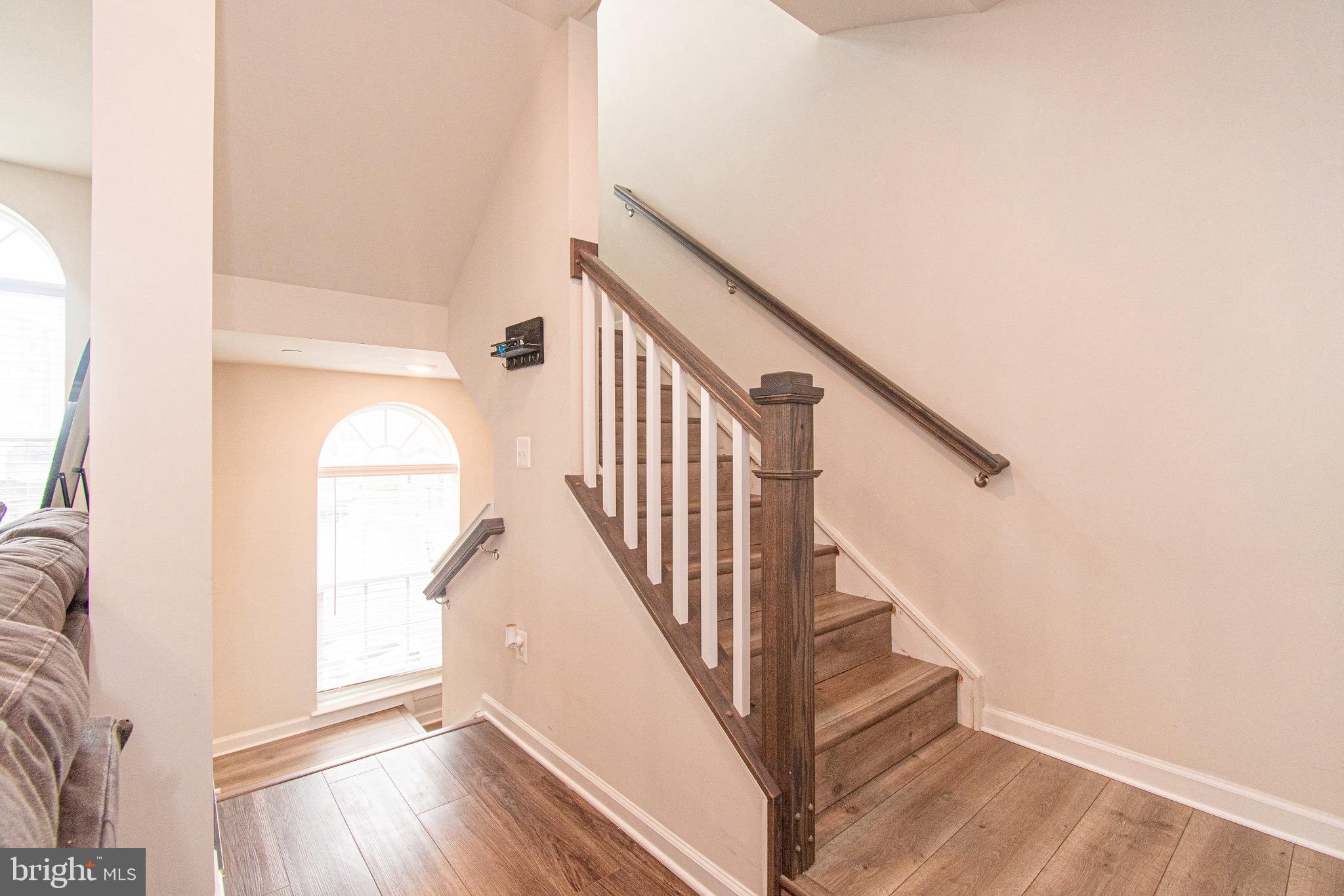 9637 Block Street Lanham, MD 20706 - Photo 9 of 47 a view of entryway and hall with wooden floor