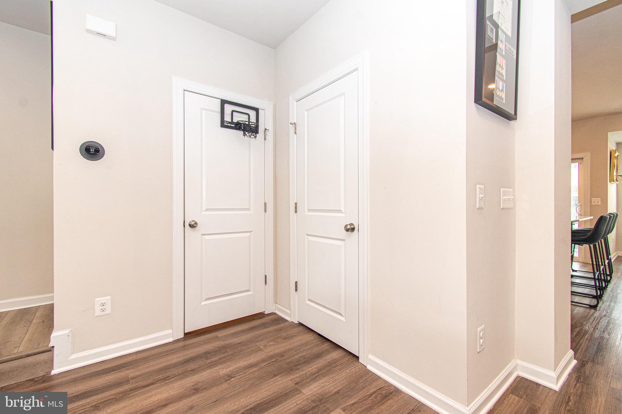 9637 Block Street Lanham, MD 20706 - Photo 10 of 47 a view of a hallway with wooden floor
