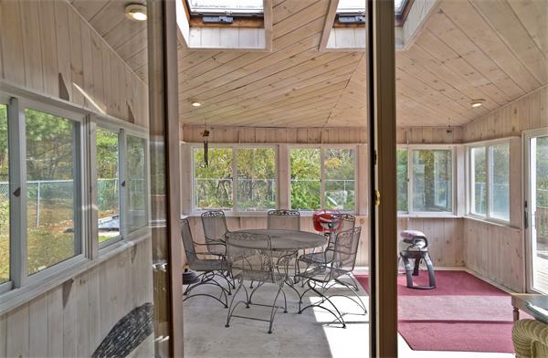 40 Mill Road Boxford, MA 01921 - Photo 16 of 20 a view of a room with a large window and dining space
