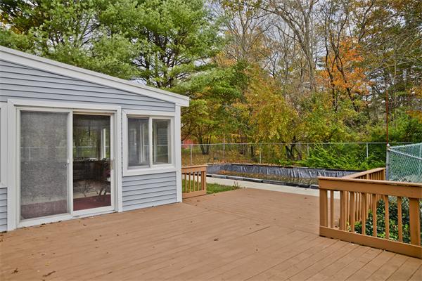 40 Mill Road Boxford, MA 01921 - Photo 18 of 20 a view of a deck with a large window and wooden fence