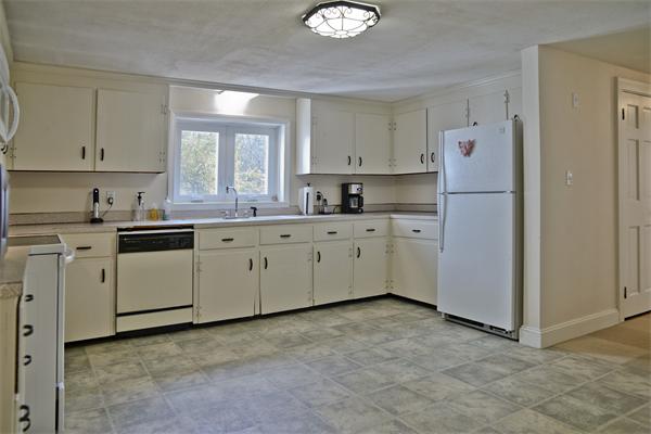 40 Mill Road Boxford, MA 01921 - Photo 3 of 20 a kitchen with white cabinets and white appliances