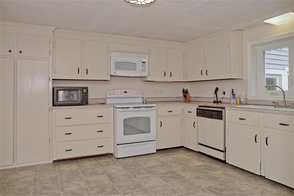 40 Mill Road Boxford, MA 01921 - Photo 4 of 20 a kitchen with cabinets stainless steel appliances and window