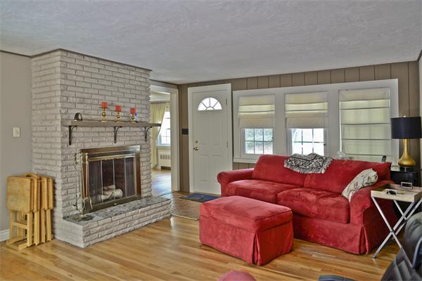 40 Mill Road Boxford, MA 01921 - Photo 8 of 20 a living room with furniture windows and a fireplace