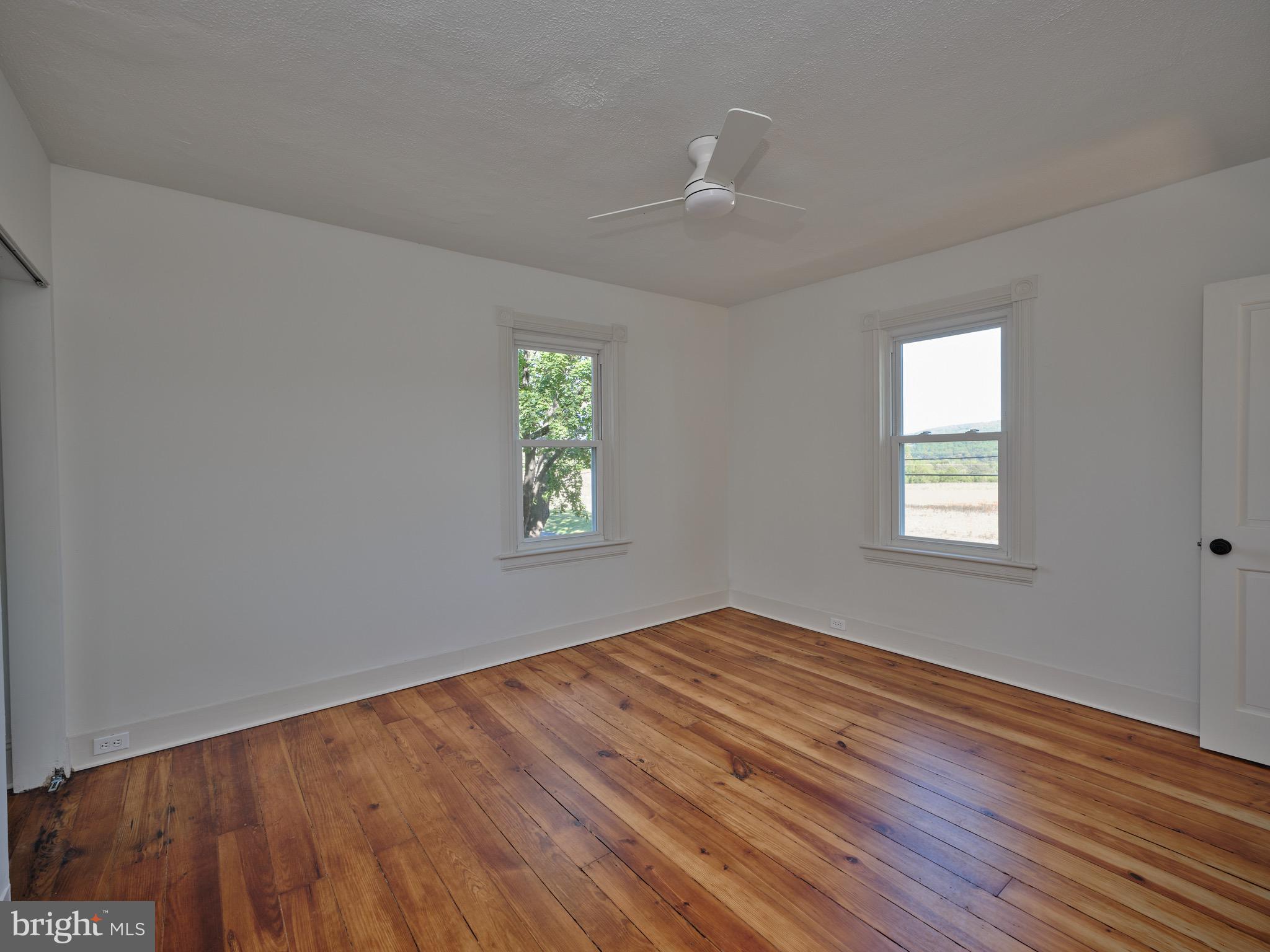 865 Sherers Hill Road Riegelsville, PA 18077 - Photo 25 of 37 wooden floor in an empty room with a window