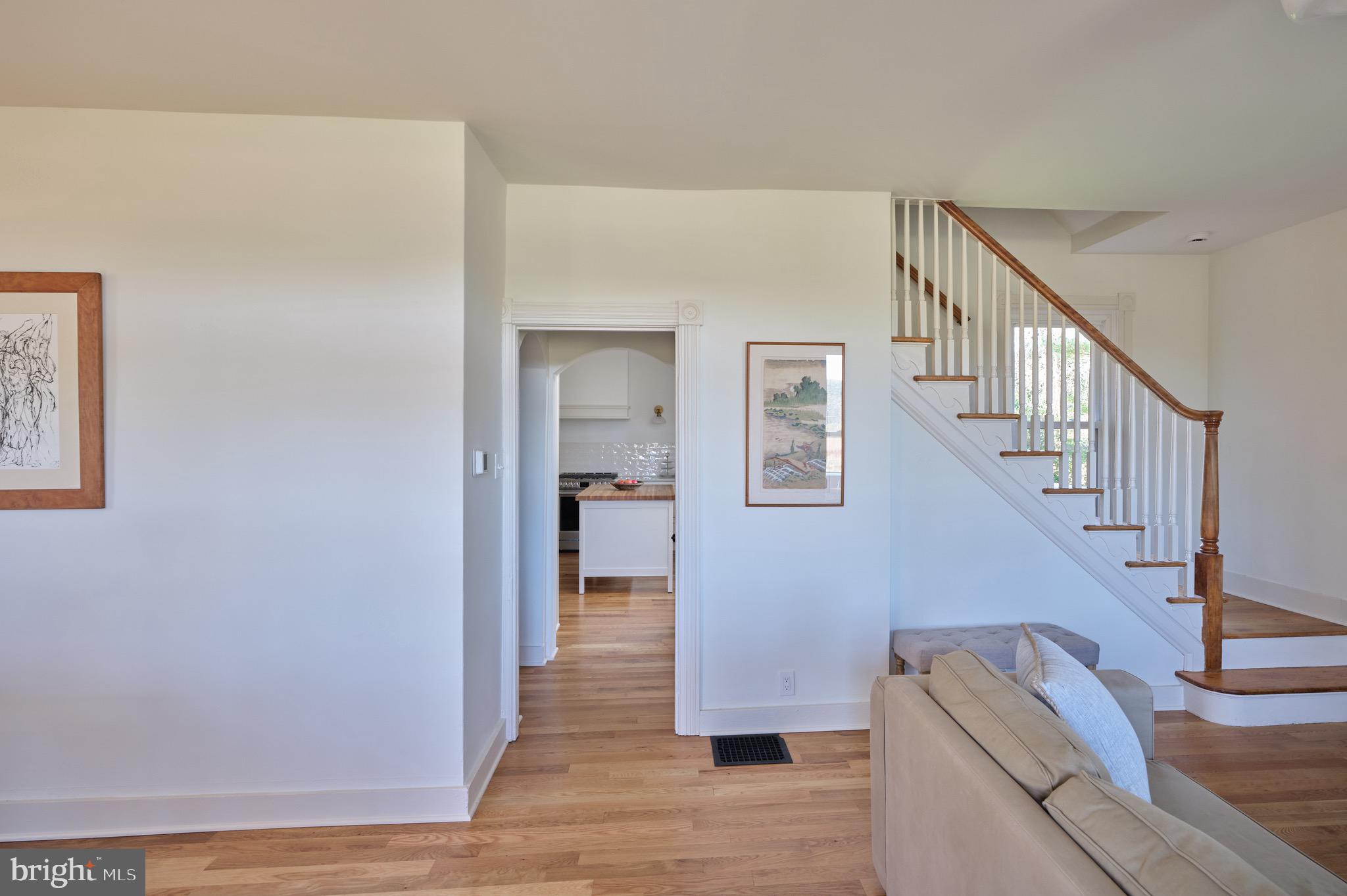 865 Sherers Hill Road Riegelsville, PA 18077 - Photo 10 of 37 a view of staircase and kitchen with wooden floor