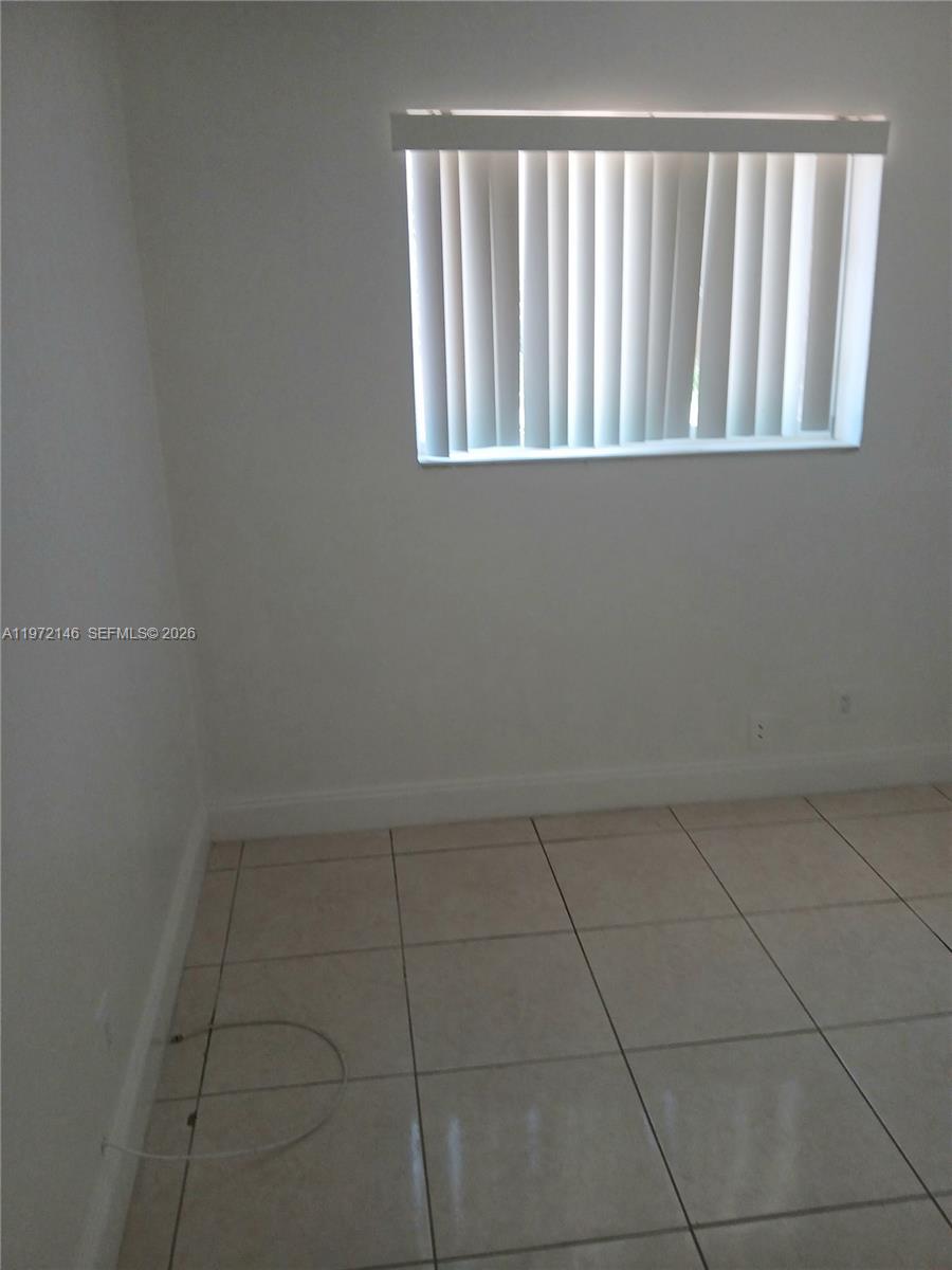6471 Southwest 27th Street, Unit 2 Miramar, FL 33023 - Photo 30 of 41 a view of a livingroom and an empty room