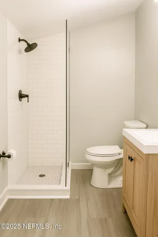 a white toilet sitting next to a bathroom sink