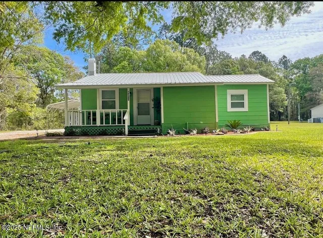 a view of a house with a garden