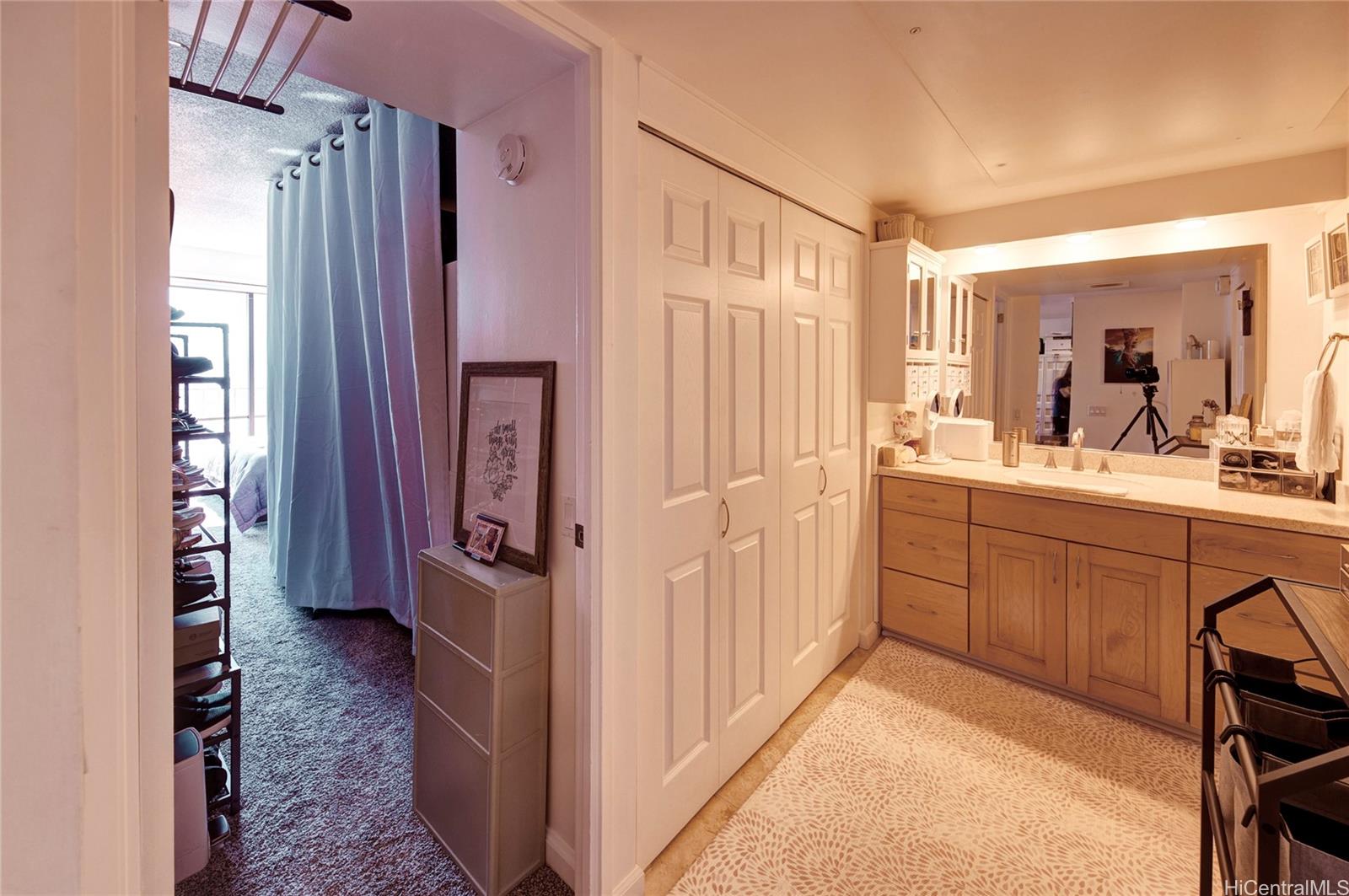 700 Richards Street, Unit 1708 Honolulu, HI 96813 - Photo 16 of 25 a bathroom with a sink a mirror and a shower