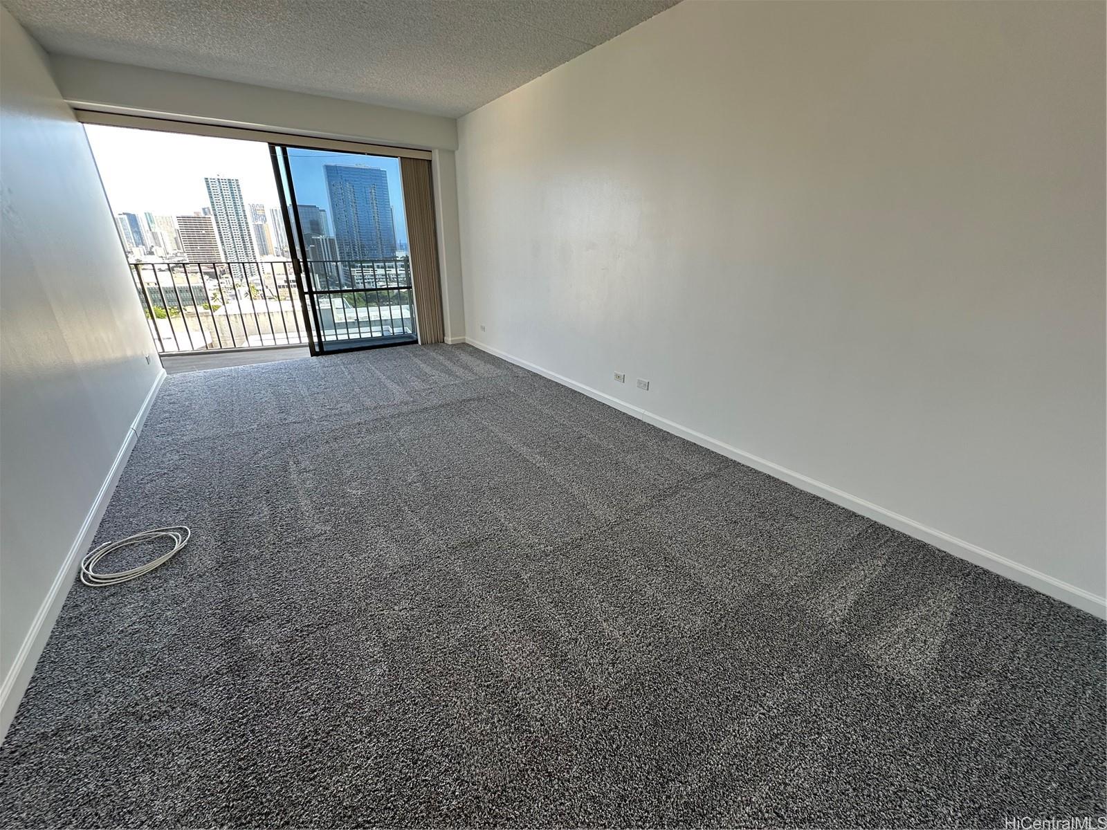 700 Richards Street, Unit 1708 Honolulu, HI 96813 - Photo 3 of 18 a view of empty room with floor to ceiling window