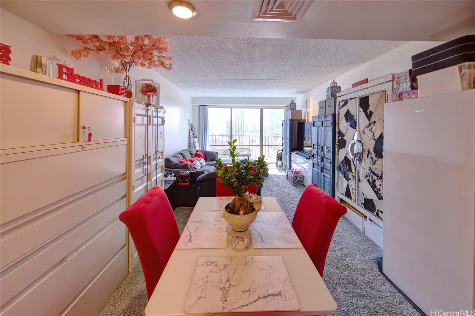 700 Richards Street, Unit 1708 Honolulu, HI 96813 - Photo 4 of 25 a view of a dining room with furniture and a window