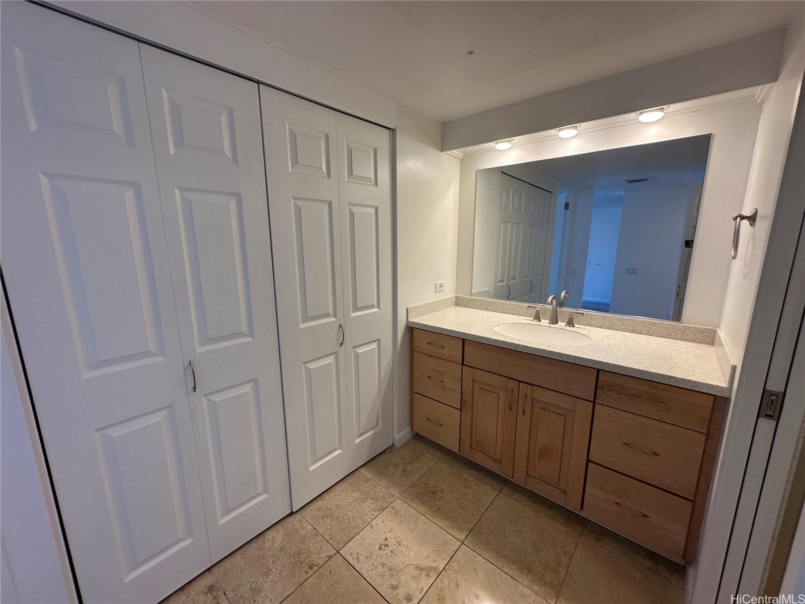 700 Richards Street, Unit 1708 Honolulu, HI 96813 - Photo 5 of 18 a spacious bathroom with a double vanity sink and a mirror