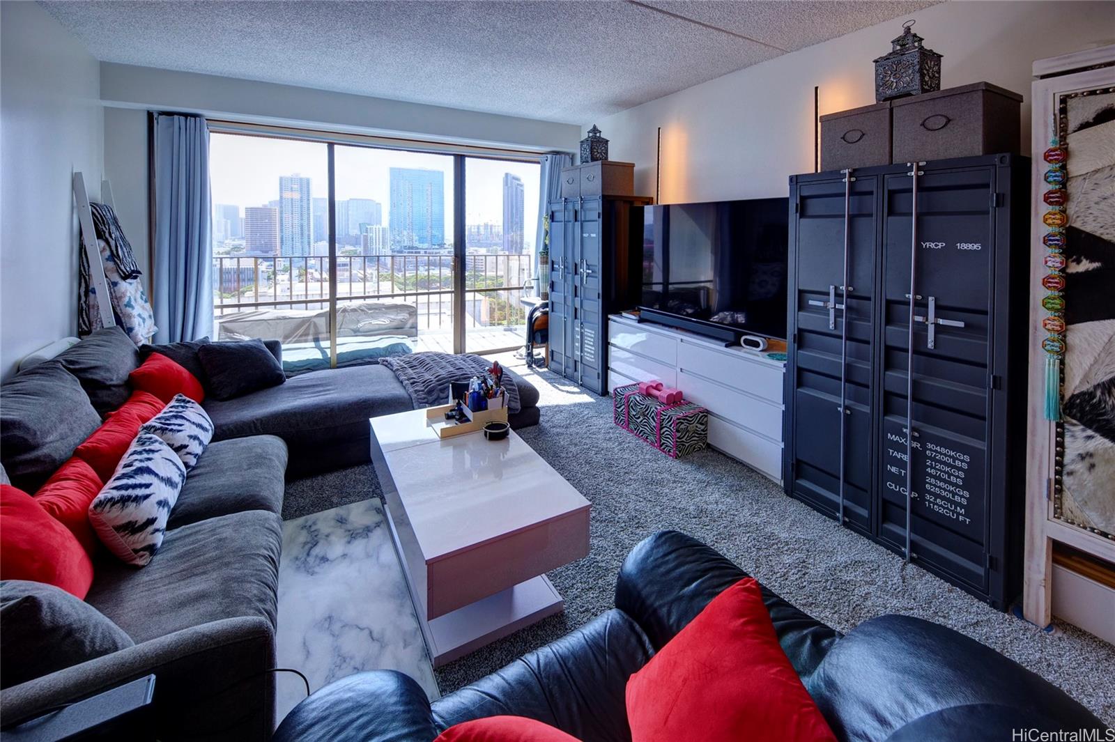 700 Richards Street, Unit 1708 Honolulu, HI 96813 - Photo 6 of 25 a living room with furniture or outdoor view and a large window